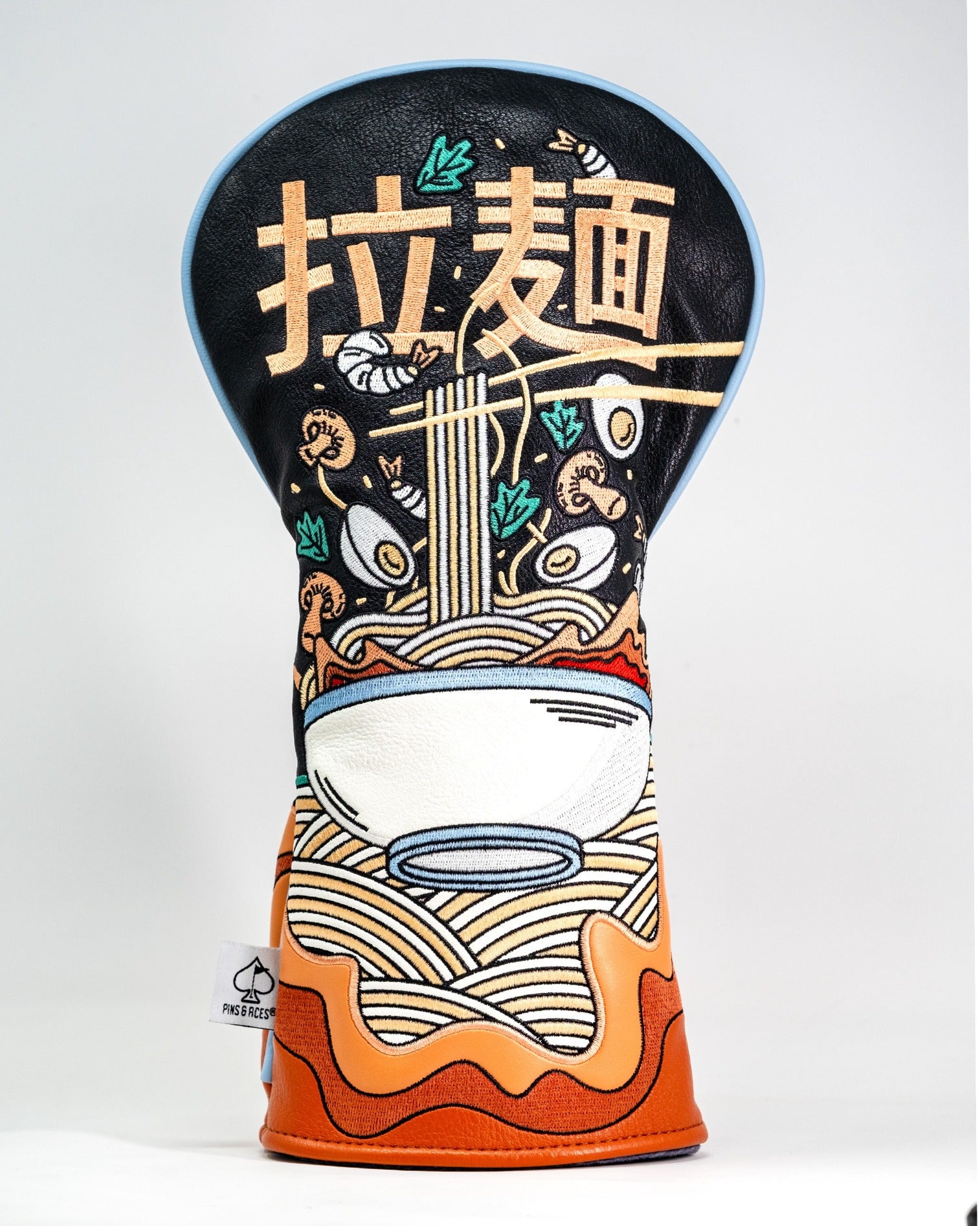 Bold ramen-themed driver cover featuring vibrant graphics of noodles, shrimp, and a bowl, perfect for unique golf style.
