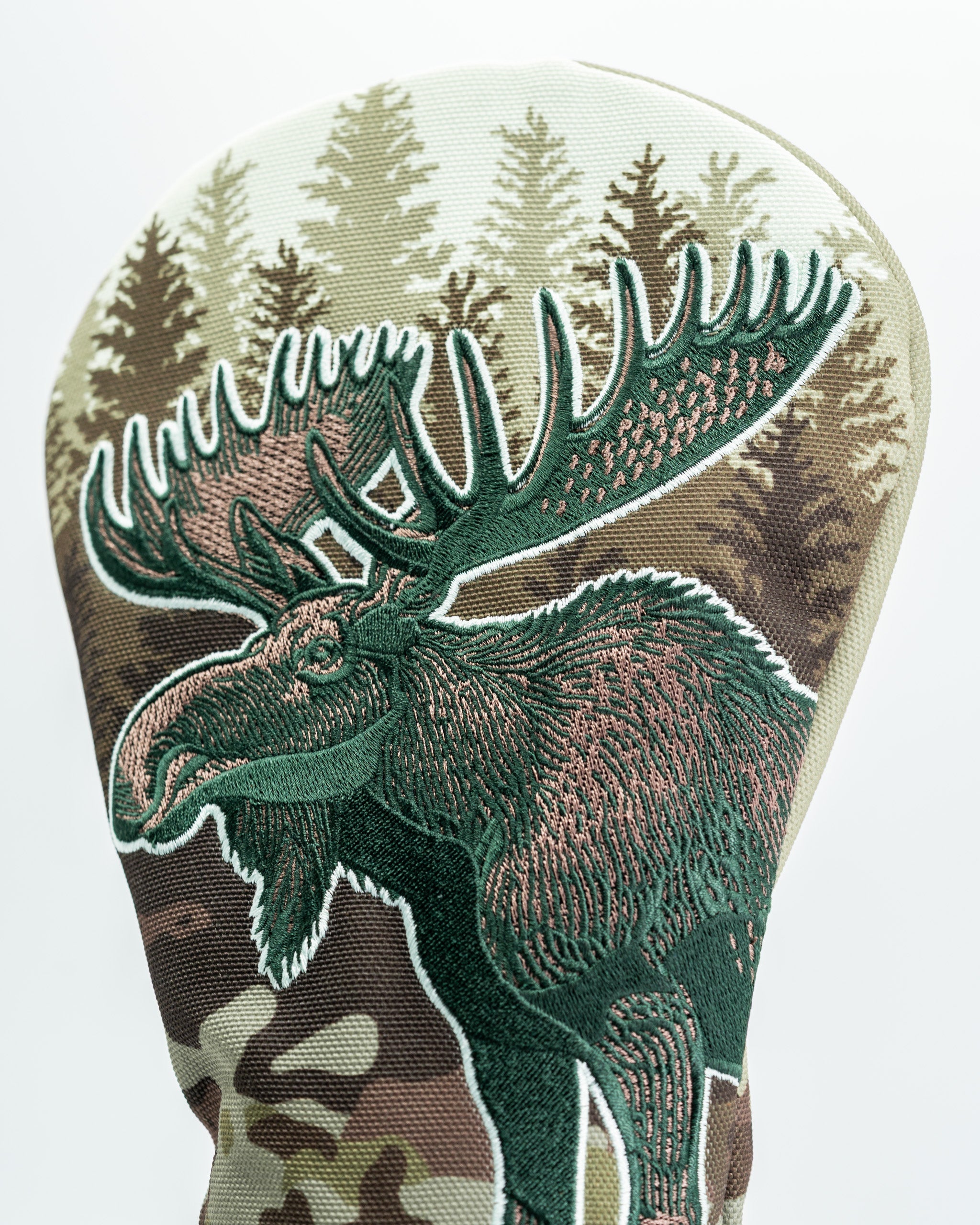Moose-themed driver cover featuring detailed embroidery and a camouflage background, perfect for standout golf style.