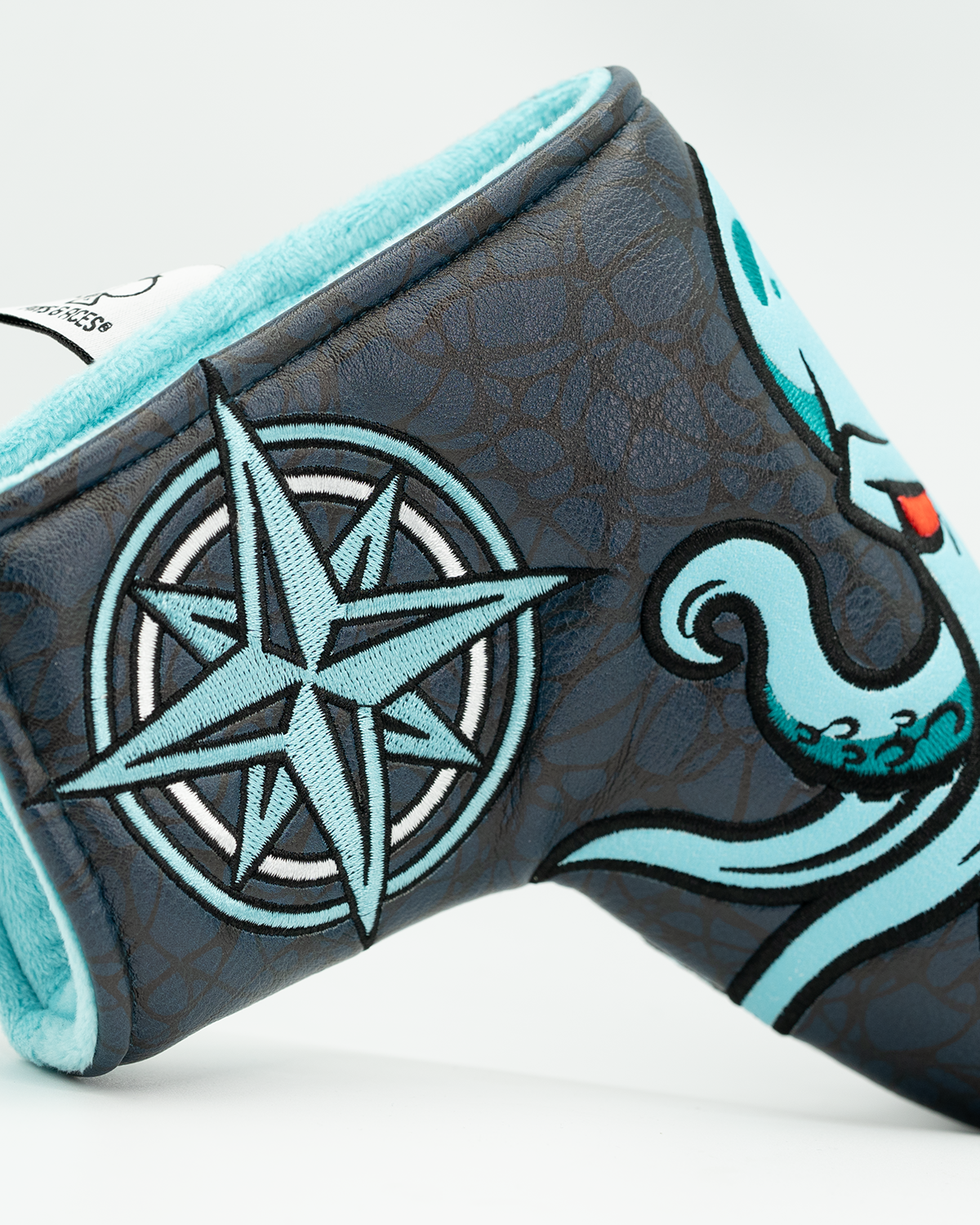 Bold Kraken blade putter cover featuring a vibrant octopus design and compass motif, perfect for standout golf style.