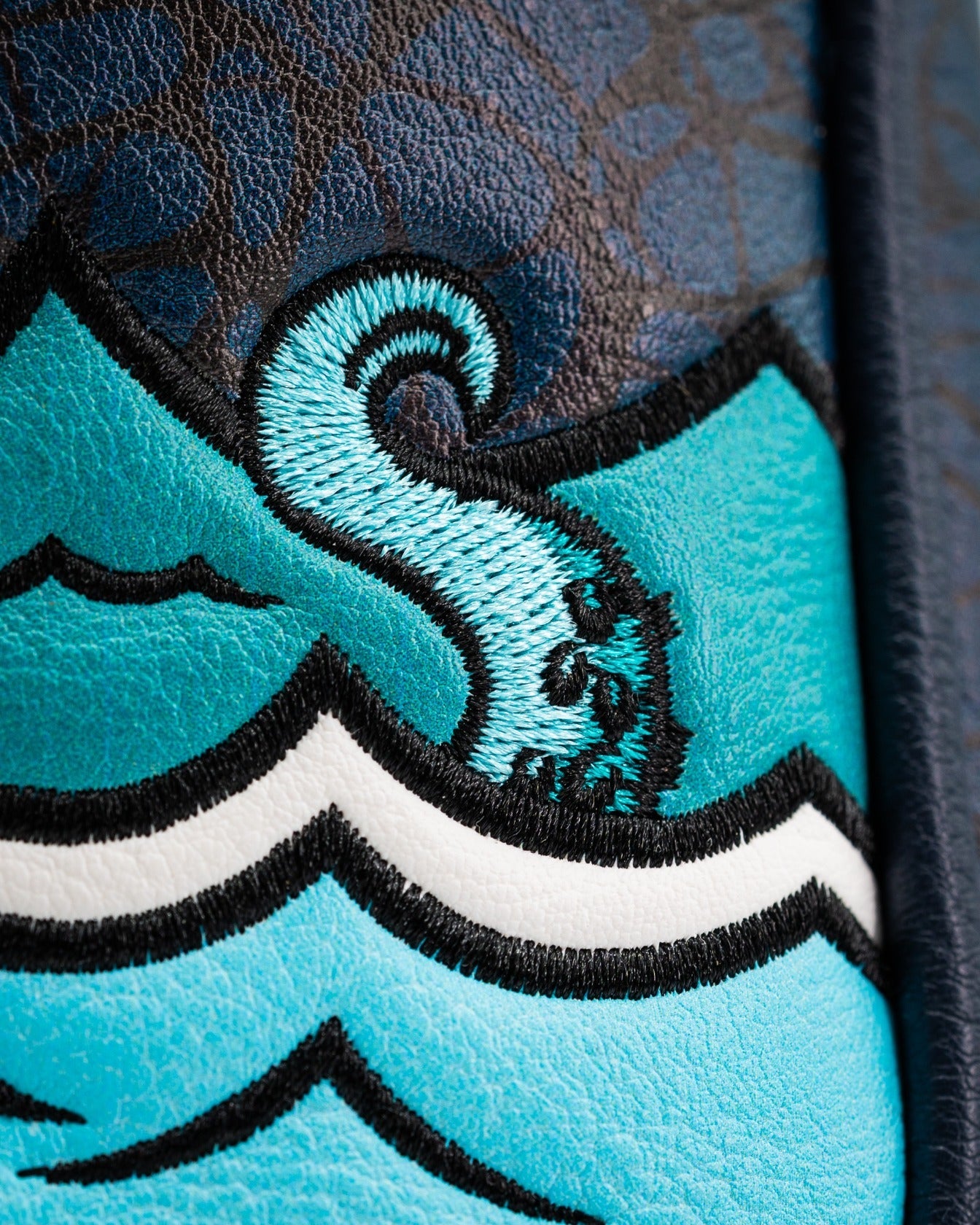 Bold Kraken mallet putter cover featuring vibrant blue waves and intricate embroidery for standout golf style.