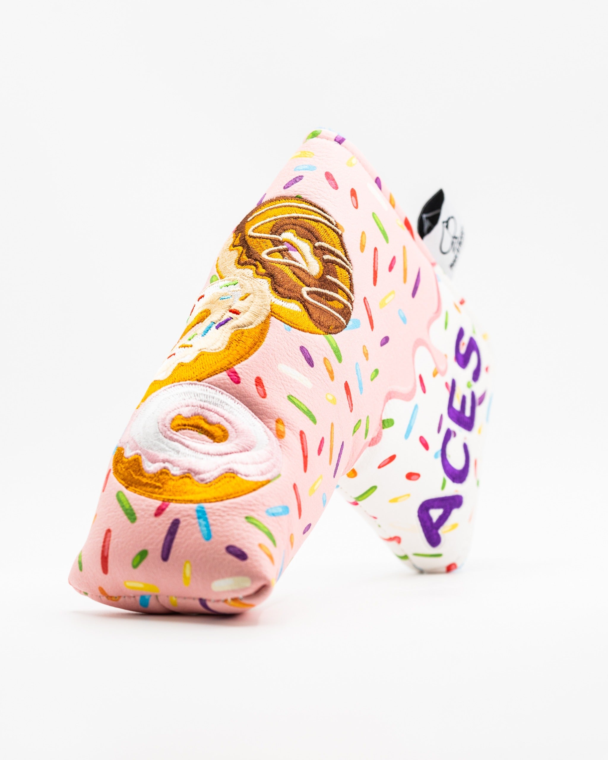 Colorful blade putter cover featuring a donut design with sprinkles, perfect for golfers seeking a fun and unique accessory.