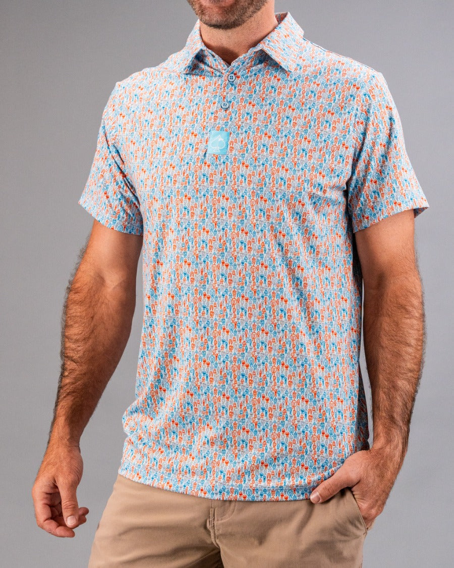 Men's short-sleeve golf shirt with a colorful, bold pattern in orange, blue, and white, perfect for standing out on the co...