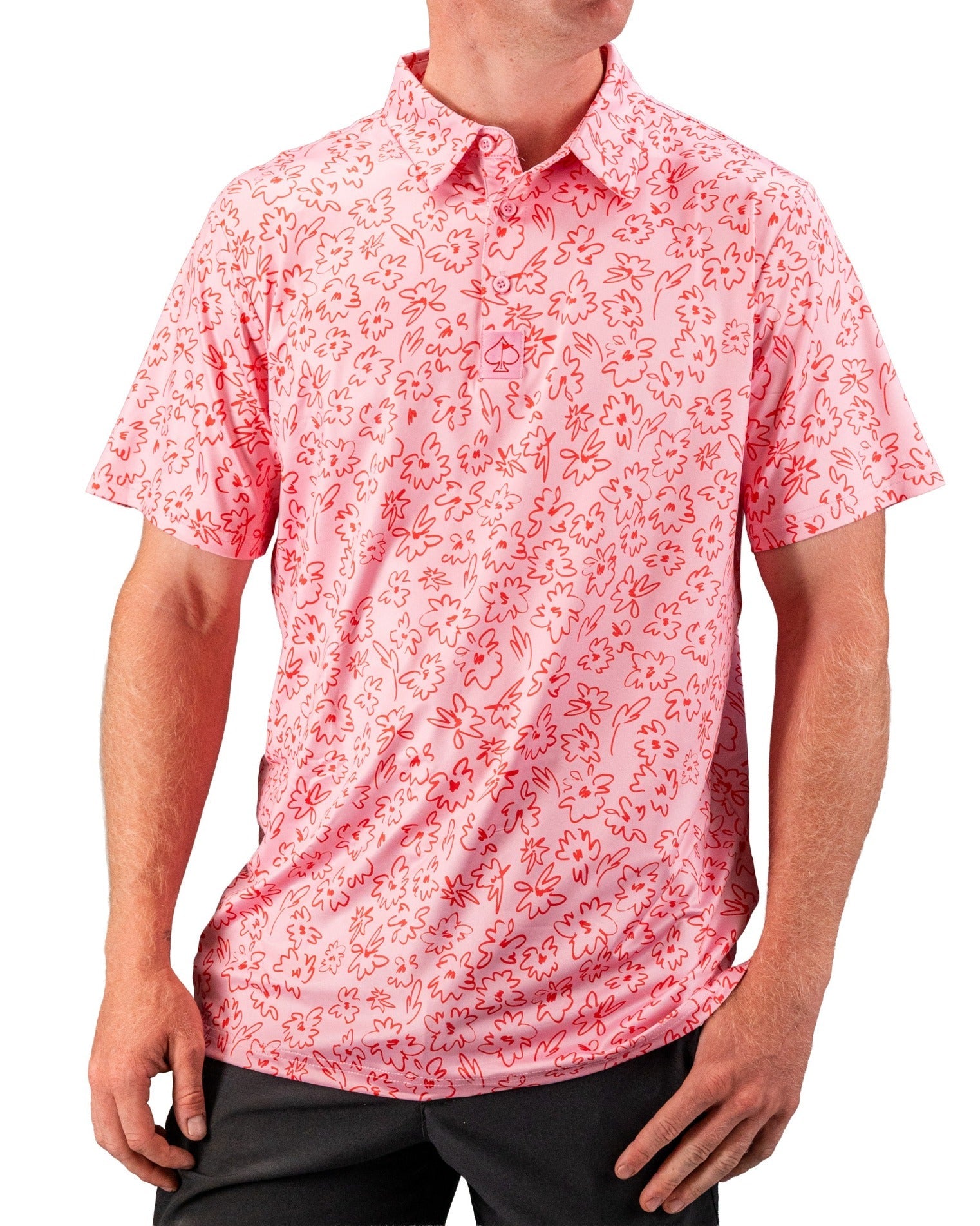 Men's short-sleeve golf shirt in pink with a playful flower doodle pattern, perfect for stylish performance on the course.