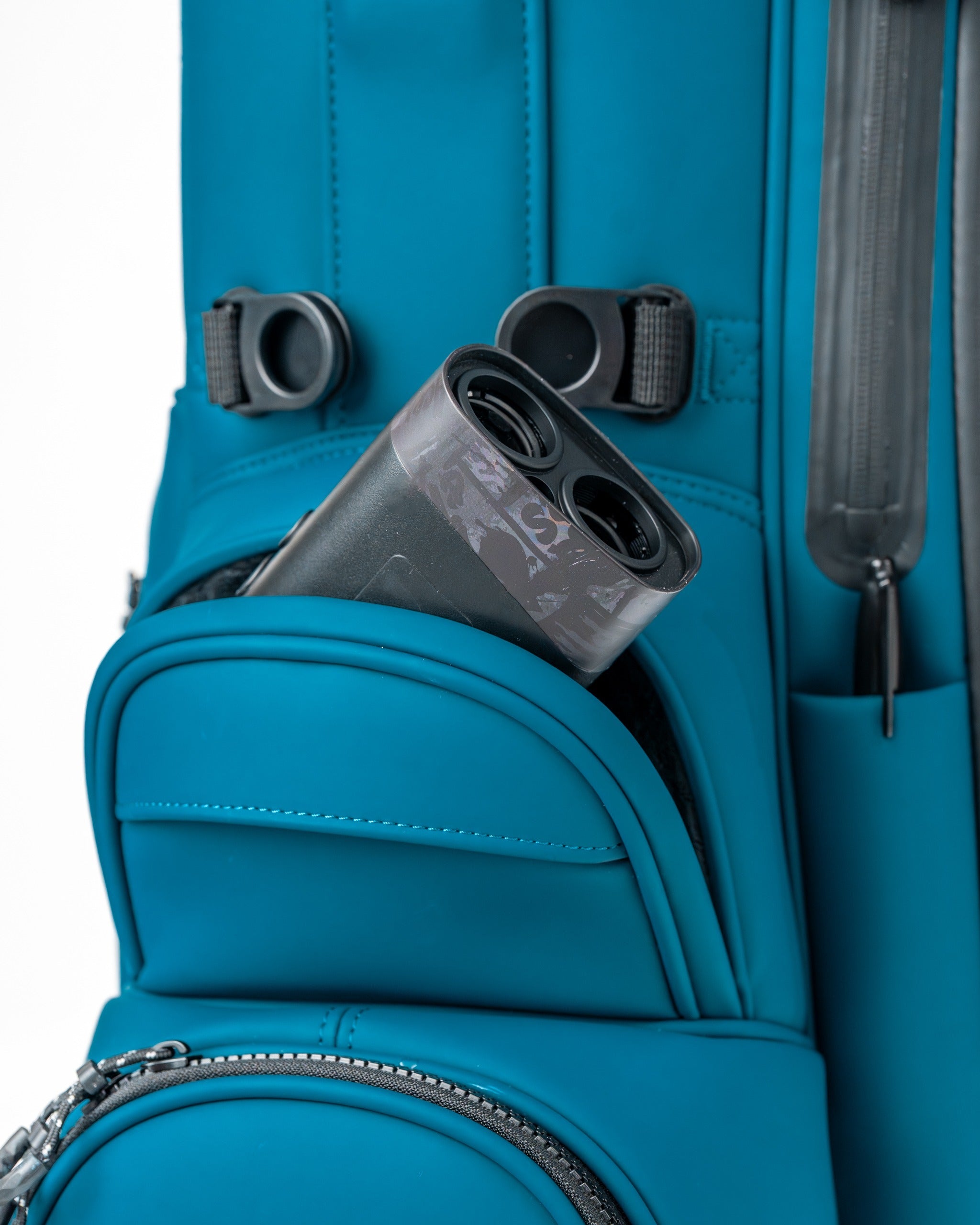Close-up of the Player Preferred Golf Bag in Sea Strike color, featuring a pocket with a golf rangefinder inside.