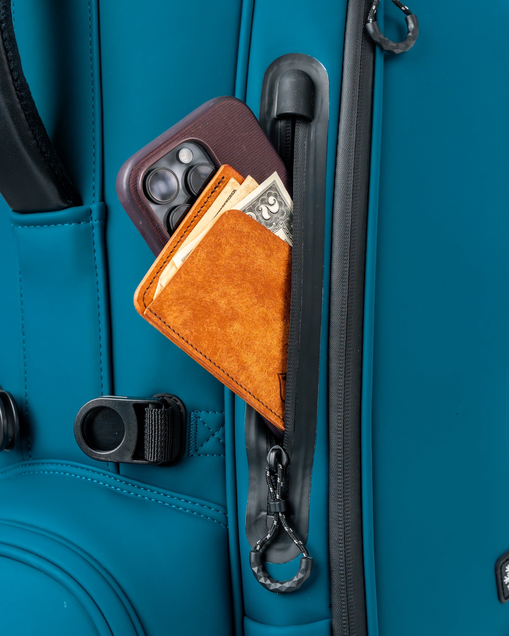 Sea Strike Player Preferred golf bag featuring a zippered pocket with a wallet and phone for convenient storage.