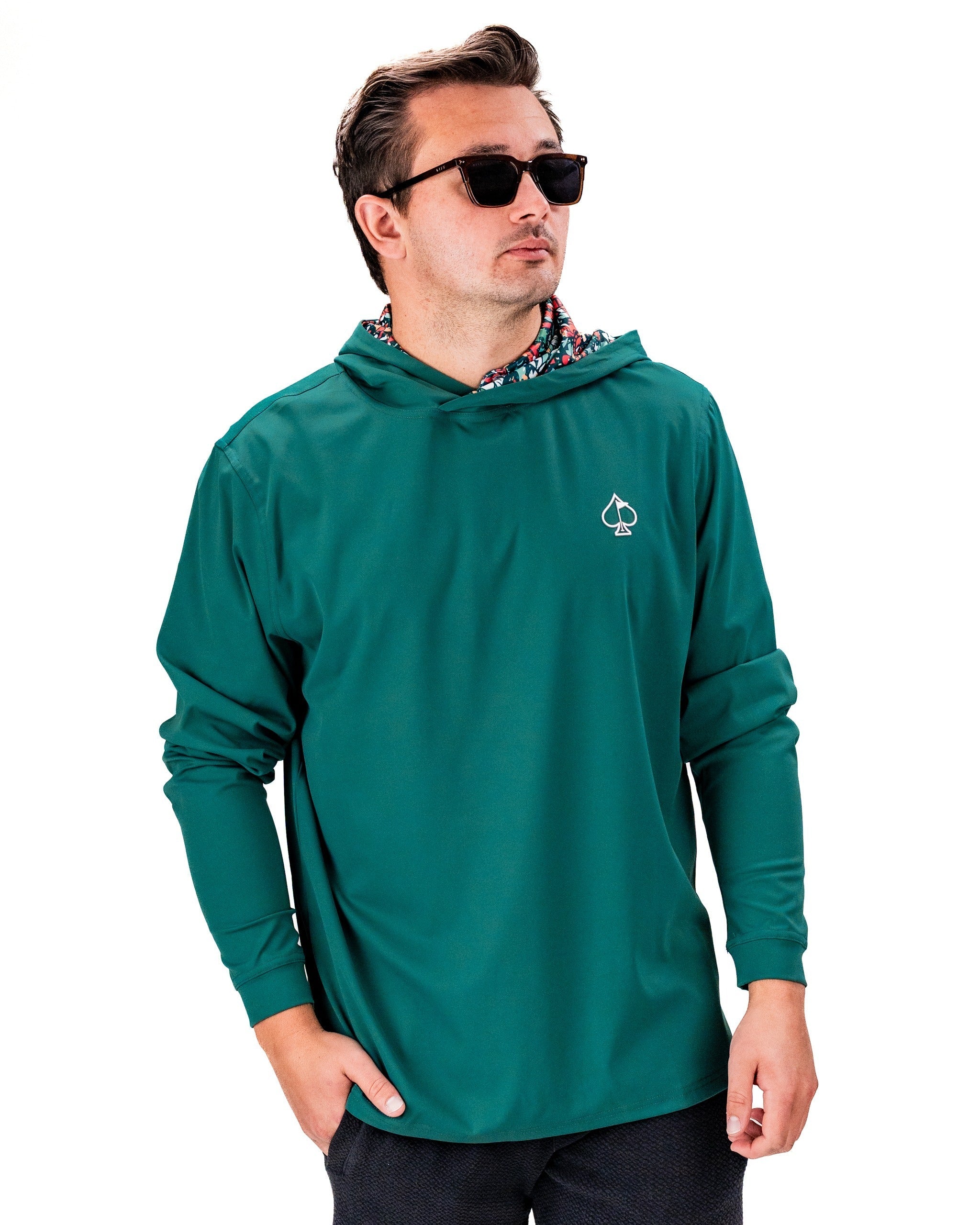 Men's performance golf hoodie in teal with a stylish hood design, perfect for golfers seeking comfort and style on the course.