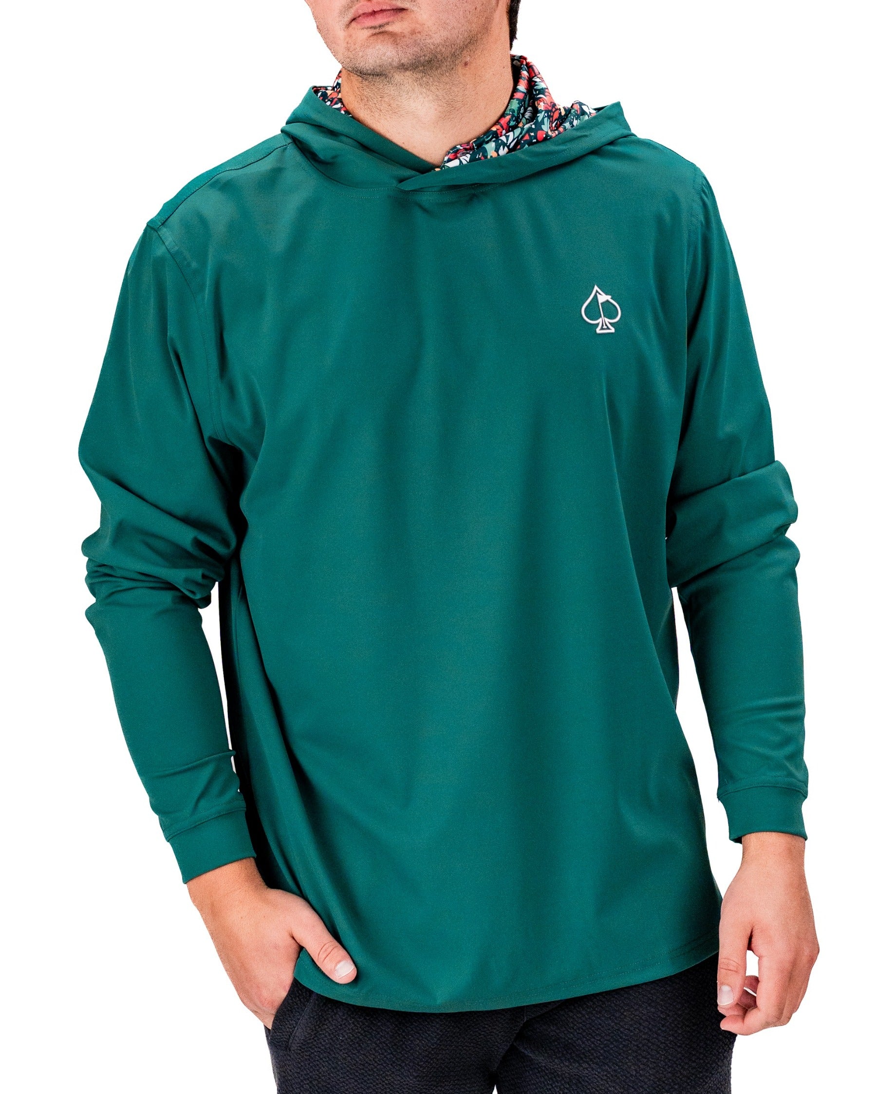 Men's teal performance golf hoodie featuring a stylish hood and a unique floral lining, perfect for on-course comfort.