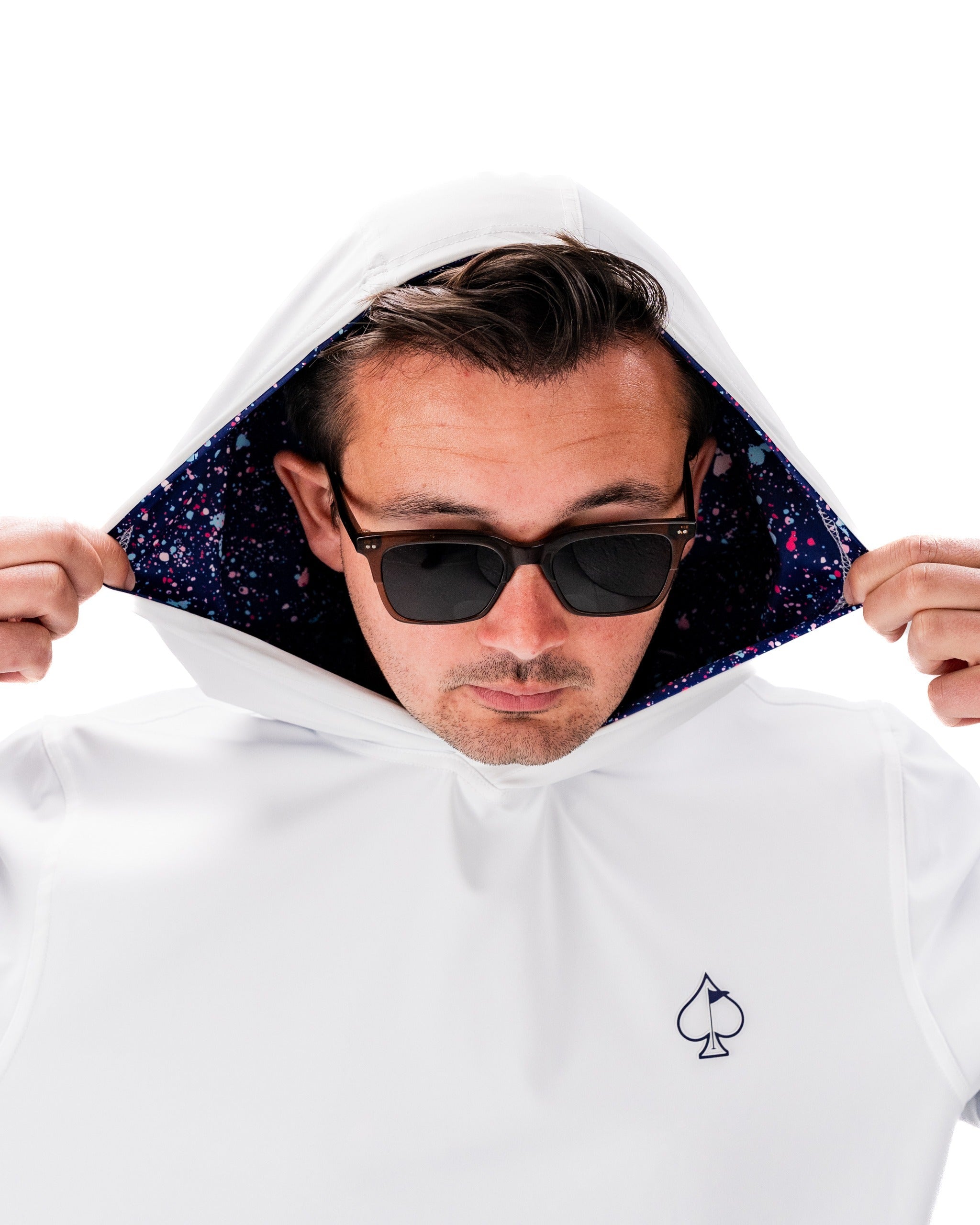 Performance golf hoodie in blue splatter design, featuring a stylish hood and vibrant interior, perfect for standout golfers.