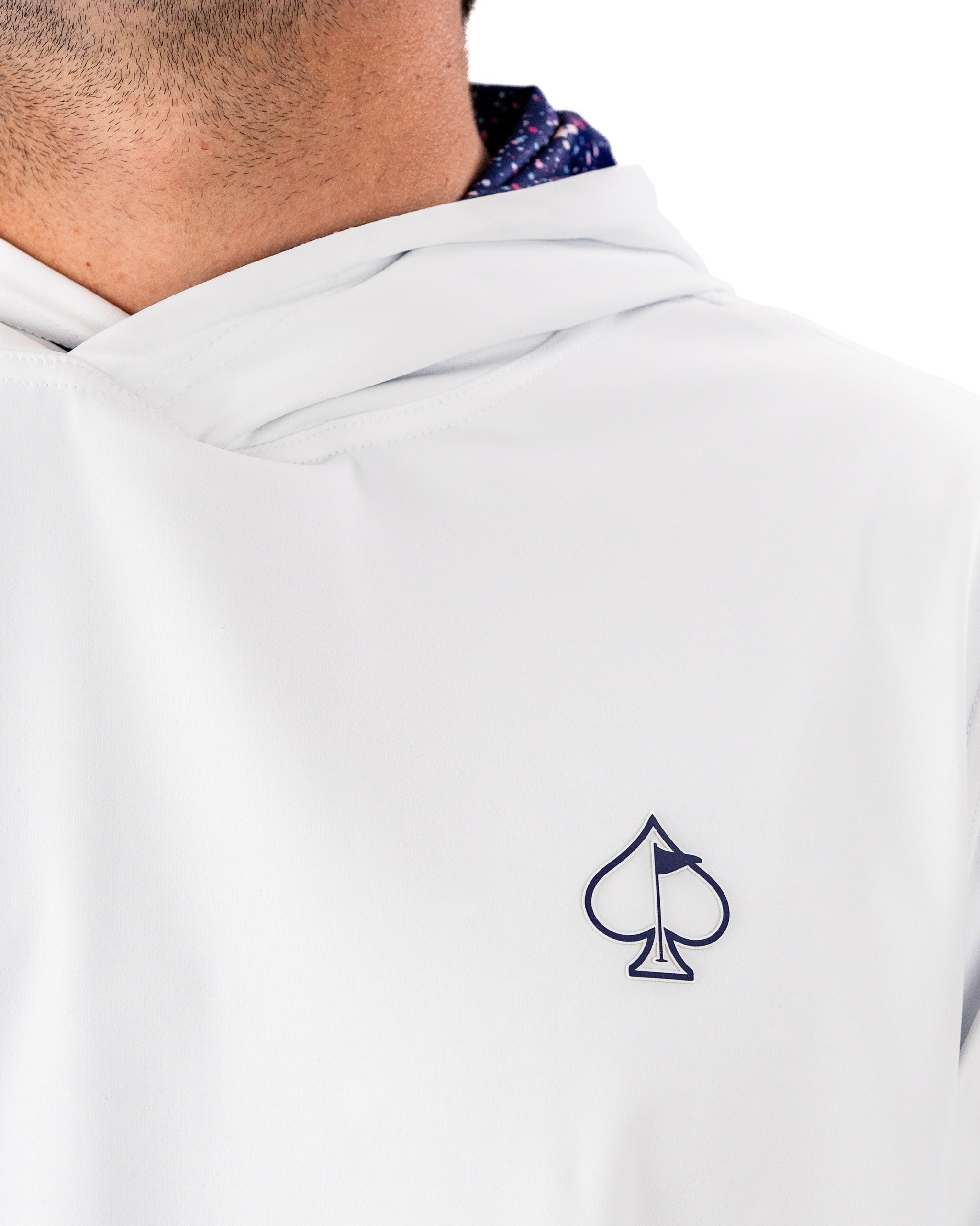 Performance Golf Hoodie in blue splatter design, featuring a stylish logo and lightweight fabric for comfort on the course.