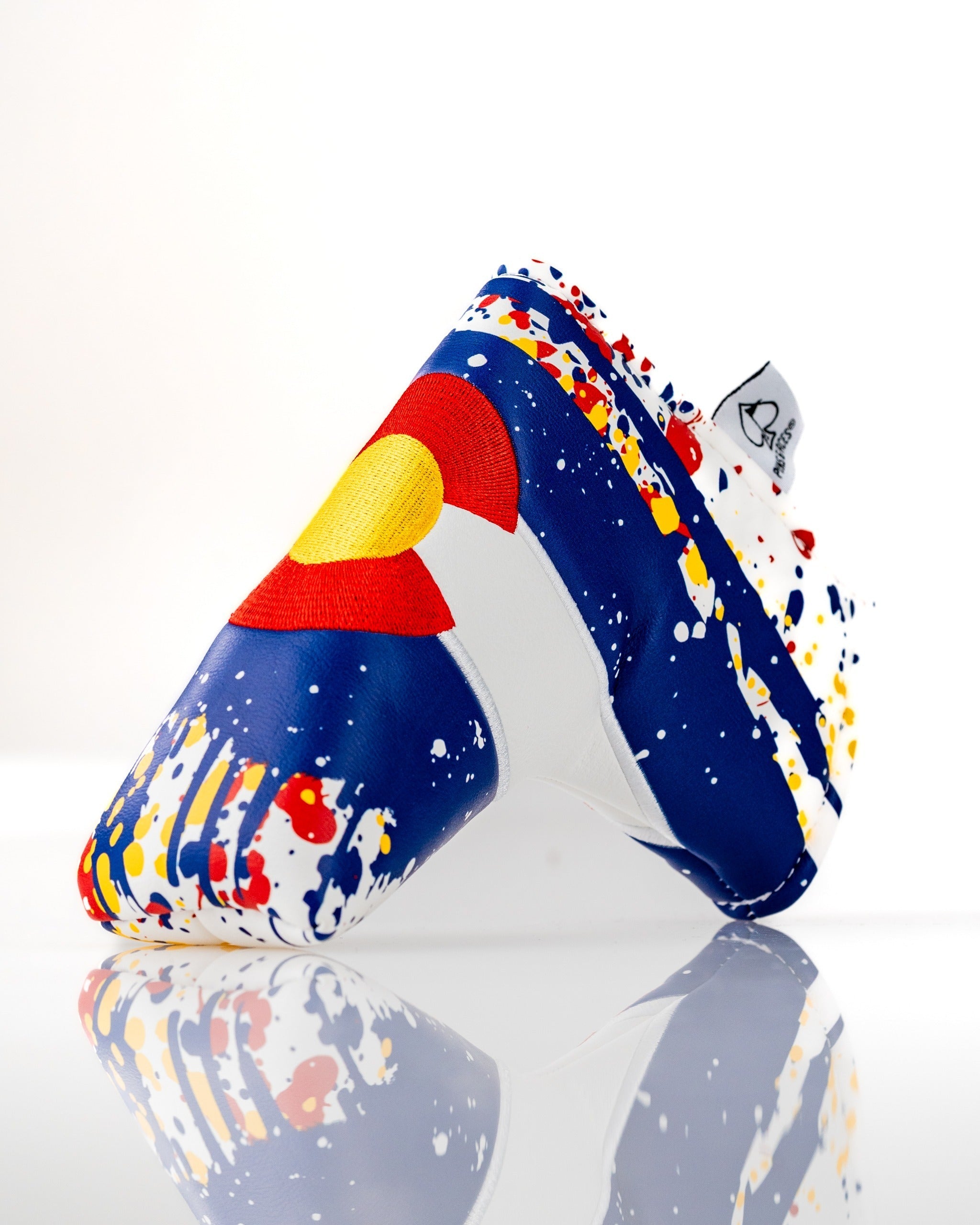Bold Colorado 2.0 blade putter cover featuring a vibrant design with splashes of color and a Colorado emblem.