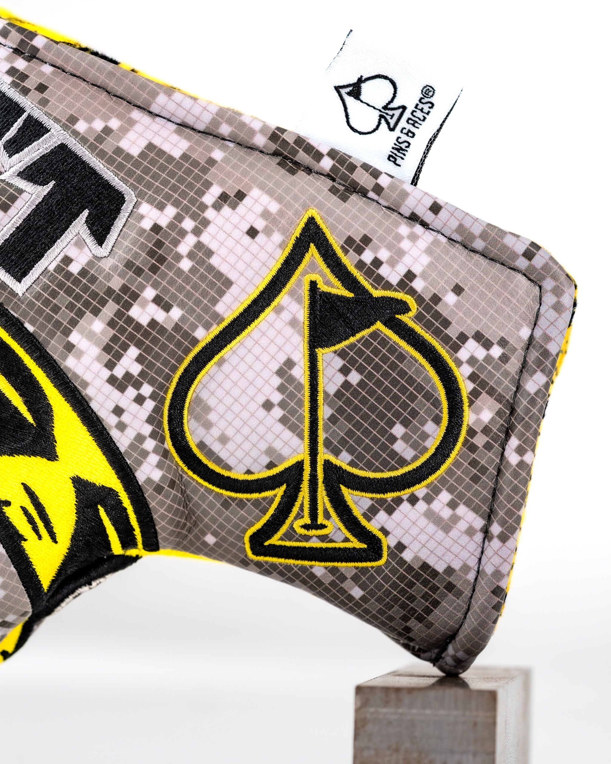 Don't Tread On Me 2.0 blade putter cover featuring a camouflage design and a bold spade logo in yellow.