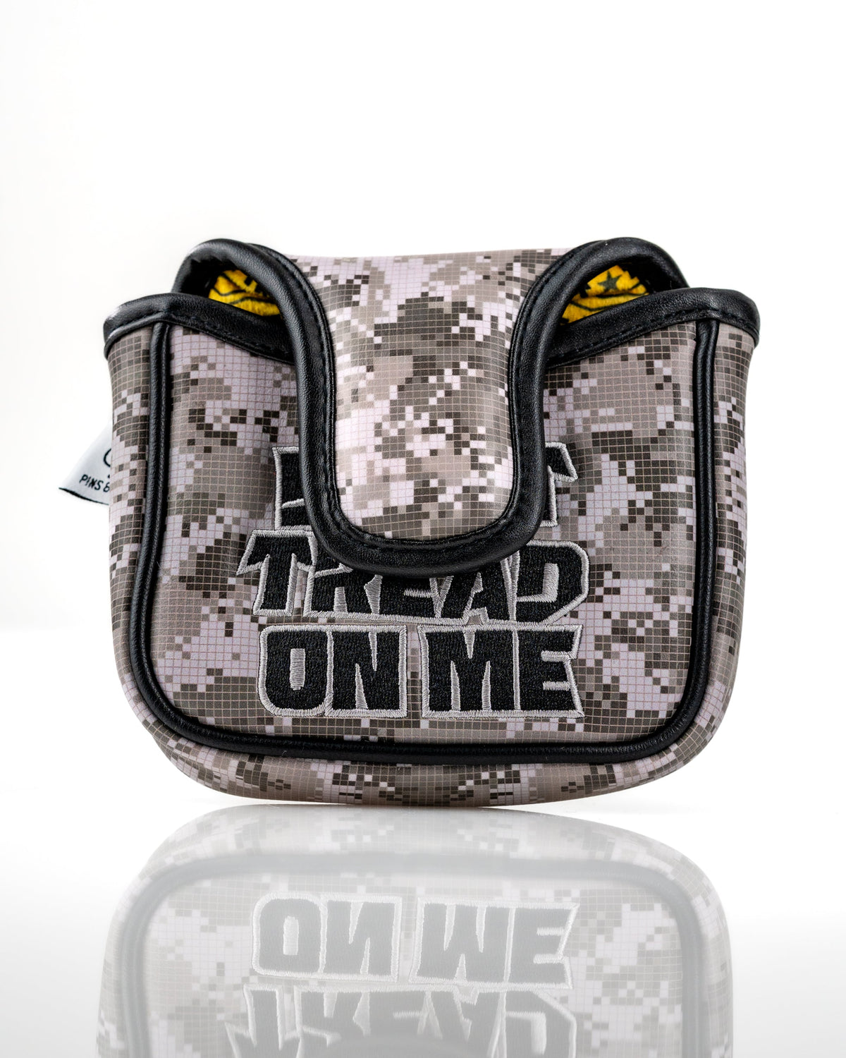 Camouflage mallet putter cover featuring "Don't Tread On Me" text, designed for golfers seeking bold accessories.