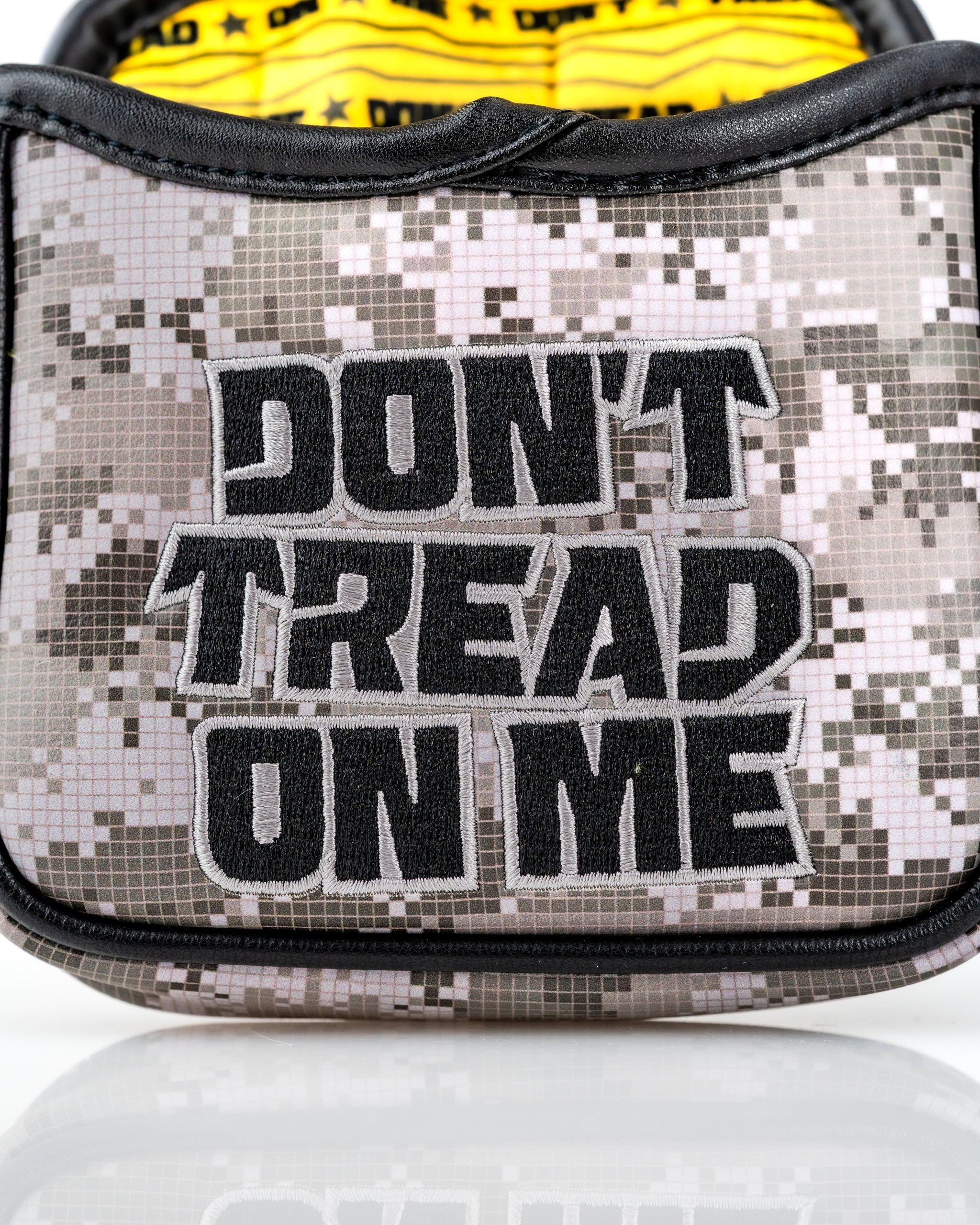 Camouflage mallet putter cover featuring bold "Don't Tread On Me" embroidery for a standout golf accessory.