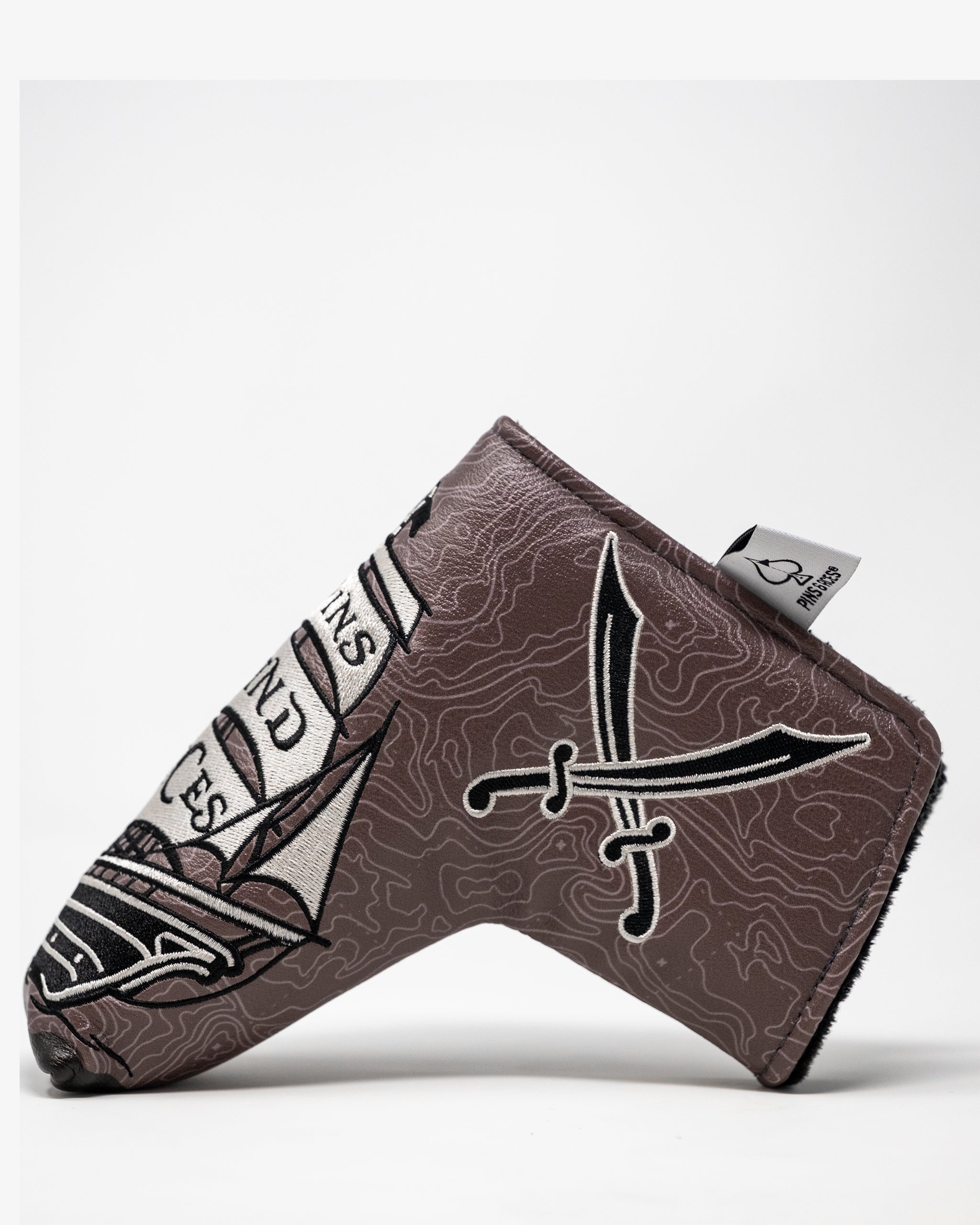 Pirate-themed blade putter cover featuring skull and crossbones design with vibrant colors.