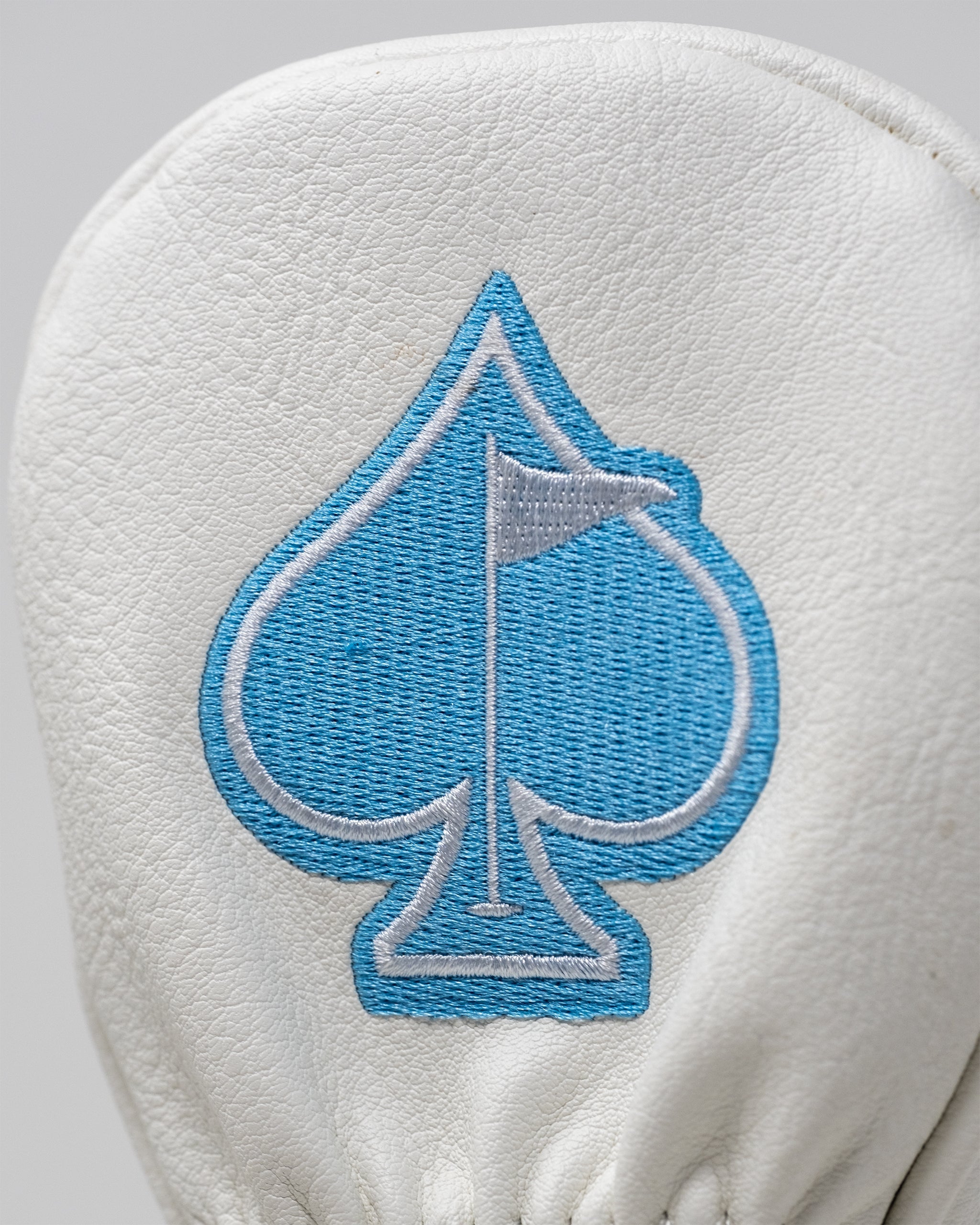 Alt text: Colorful pizza-themed hybrid golf club cover featuring vibrant toppings and a whimsical design.