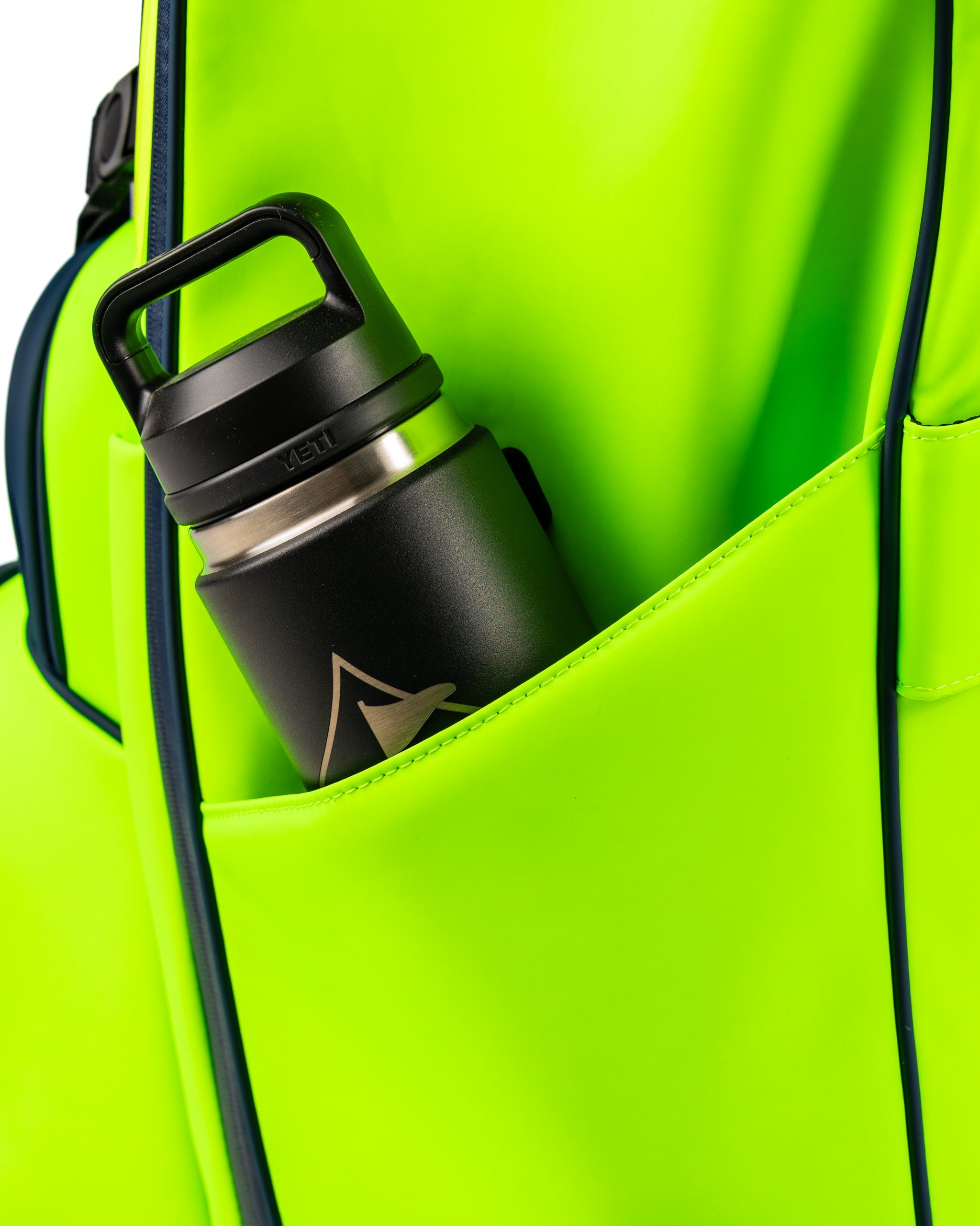 Bright electric tide golf bag featuring a spacious pocket with a black insulated water bottle for hydration on the course.