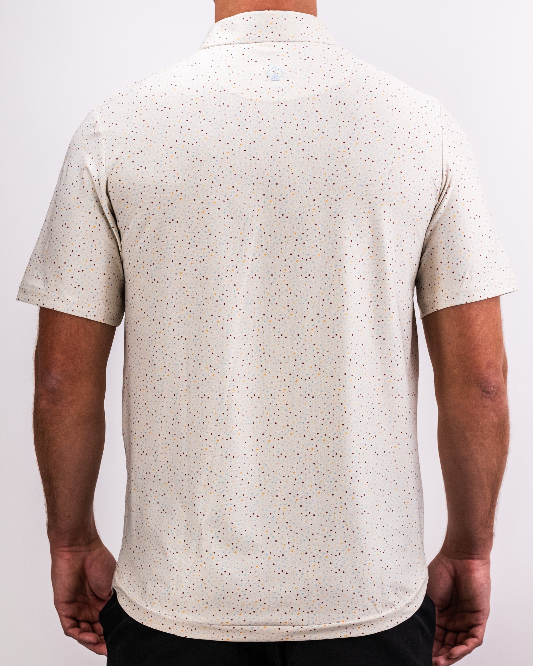 Player Preferred™ Polo in Terrazzo design, featuring a modern fit and vibrant color pattern.