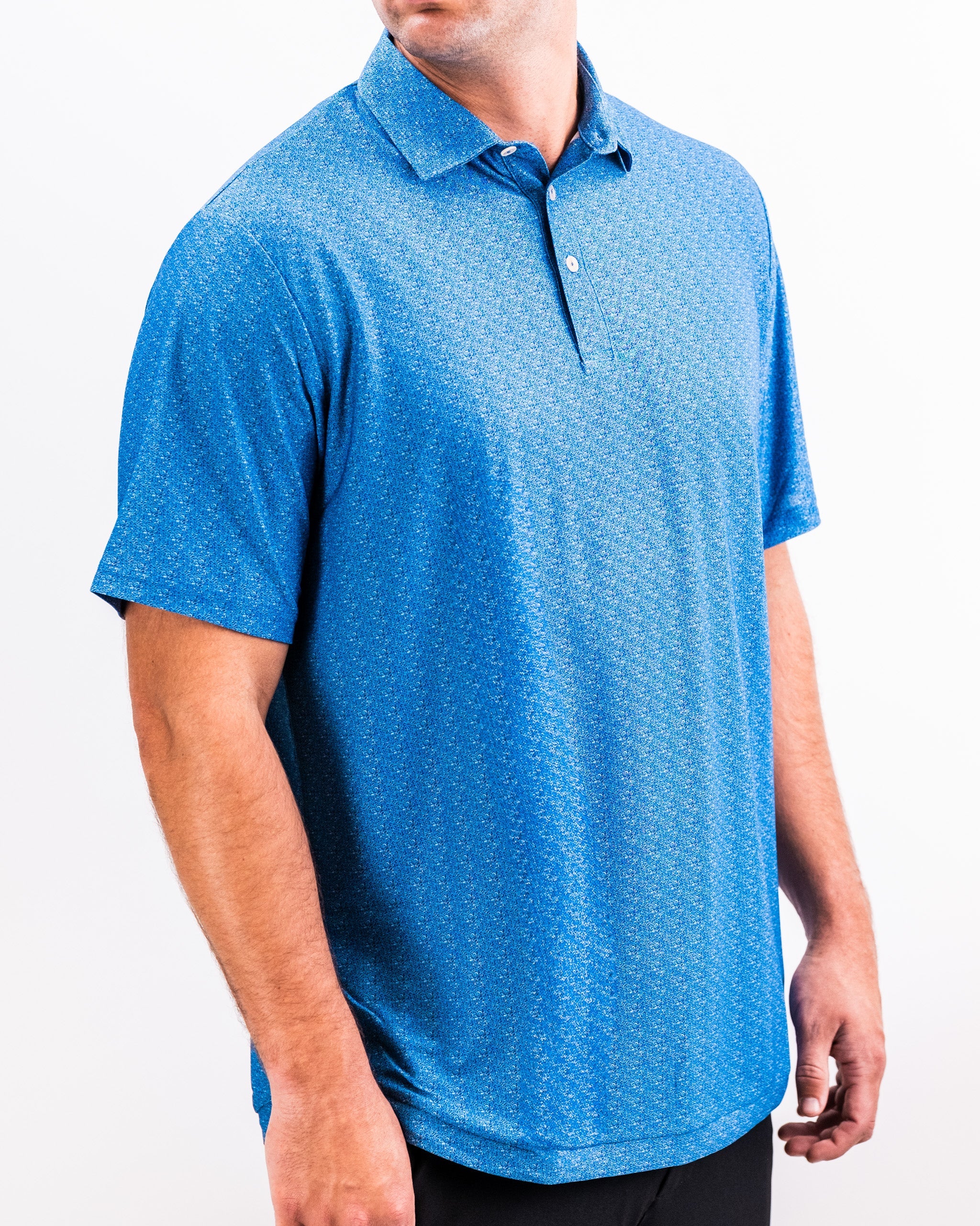 Player Preferred™ Polo in Cosmic Swirl design, featuring a vibrant pattern with swirls of blue, purple, and black.
