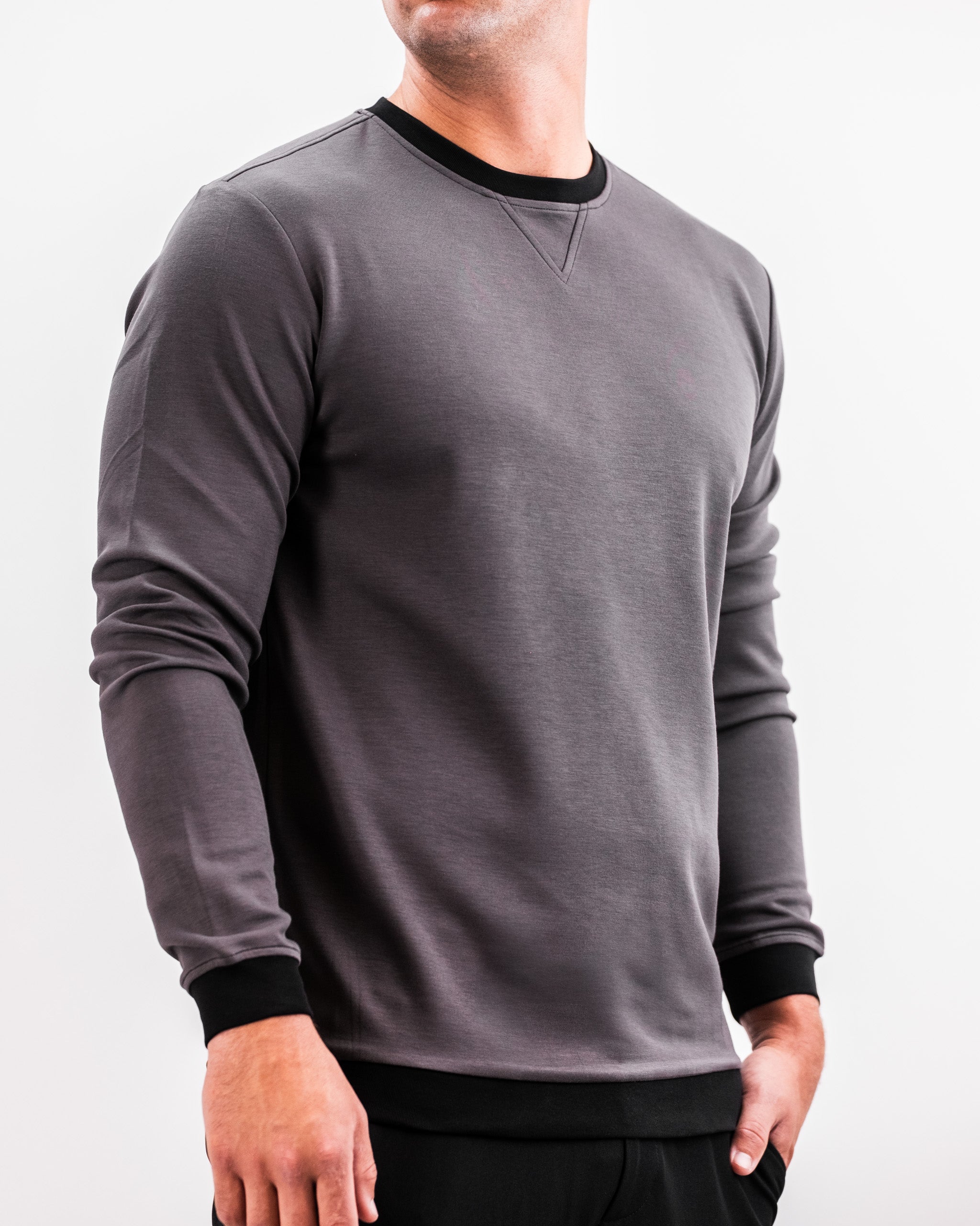 Men's slate grey crewneck sweatshirt with black trim at the neckline and cuffs, featuring a relaxed fit and subtle stitching details.