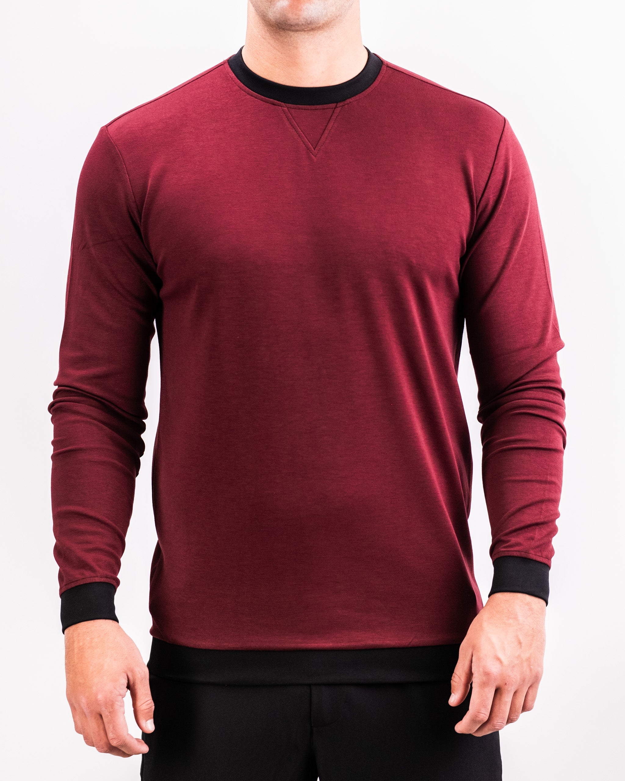 Men's maroon Crewneck sweatshirt with black cuffs and neckline, featuring a subtle textured fabric and a V-shaped stitch detail.