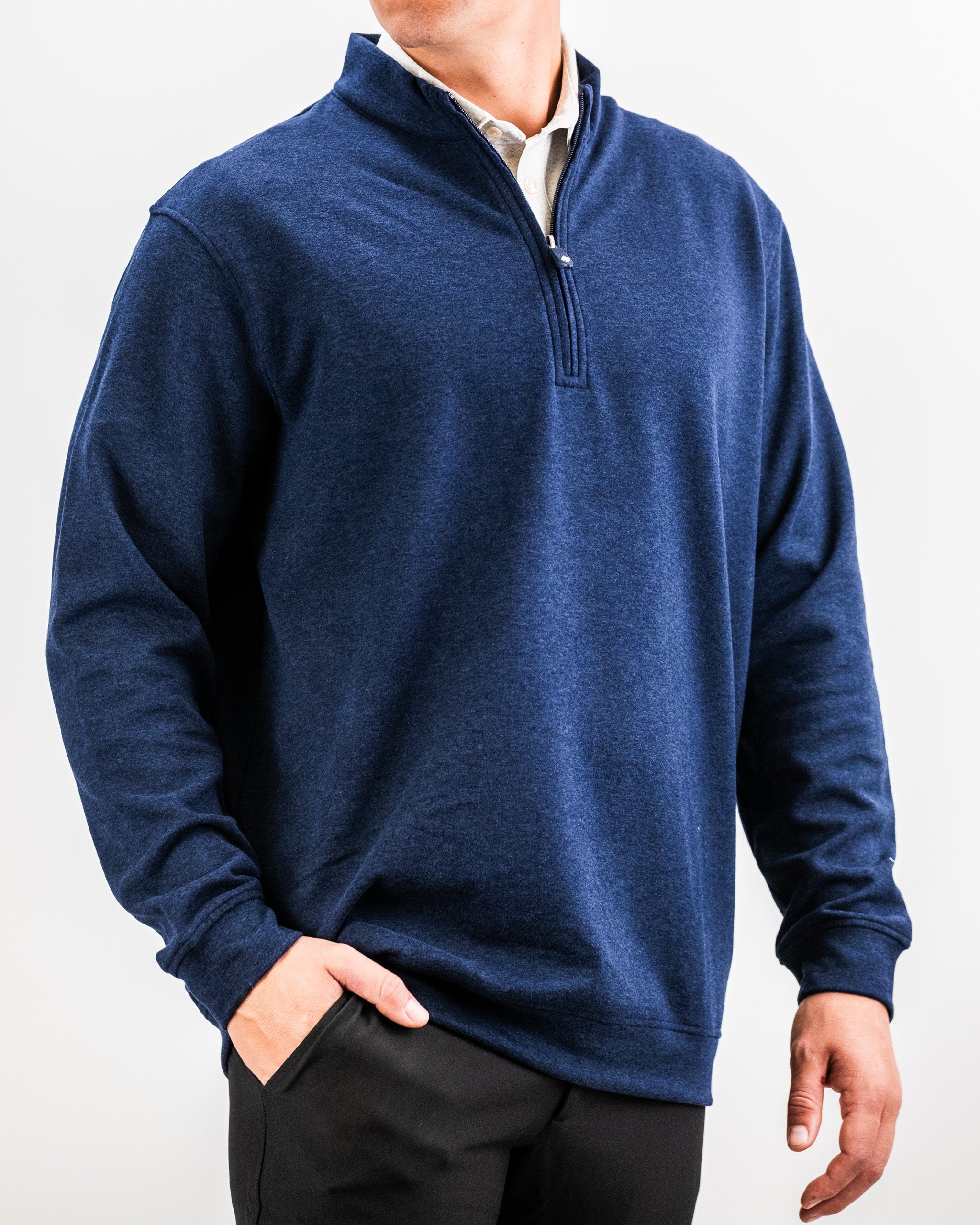Men wearing a Heathered Navy Player Preferred™ Pullover with a quarter-zip collar, standing against a plain white background.