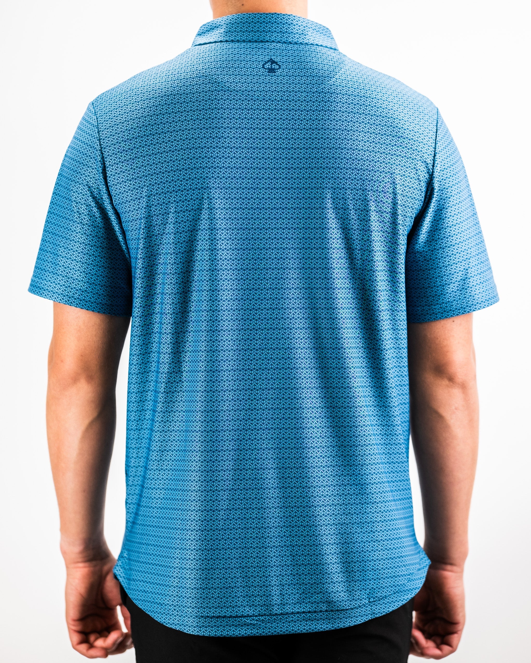 "Player Preferred™ Polo in Ocean Spade, showcasing a vibrant blue color with a classic polo design and subtle branding."