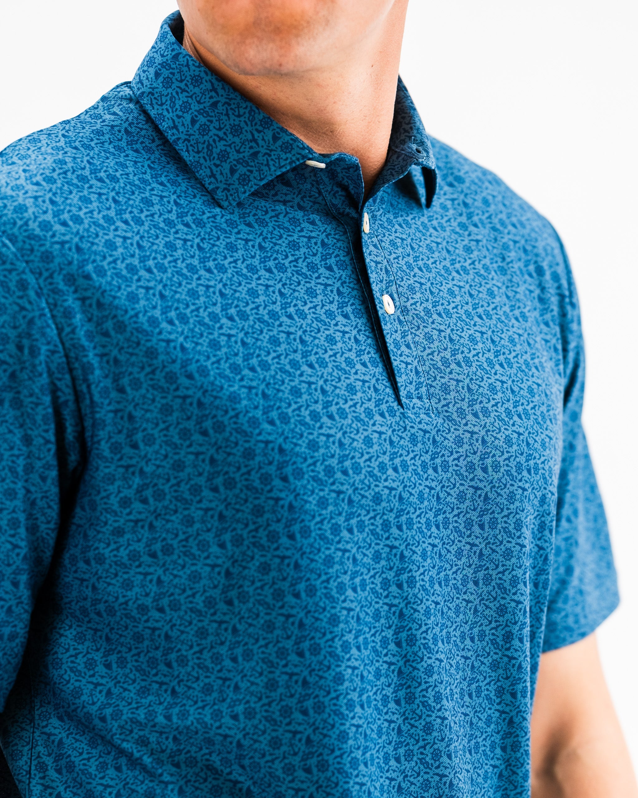 Player Preferred™ Polo - The Mariner, featuring navy blue fabric and a classic fit, with subtle logo detailing on the chest. Perfect for casual and athletic wear.