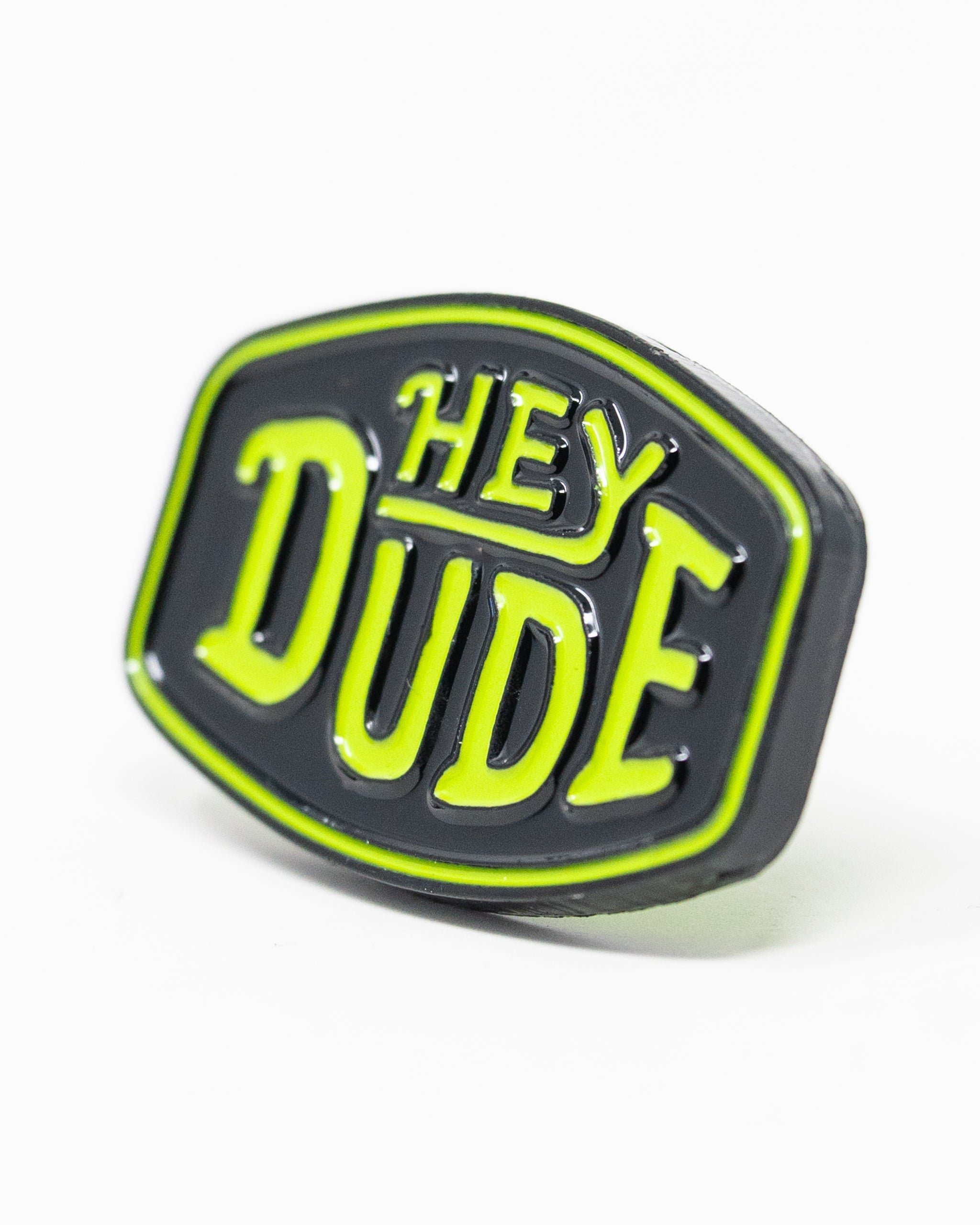 HEYDUDE logo ball marker featuring a circular design, ideal for golf enthusiasts.