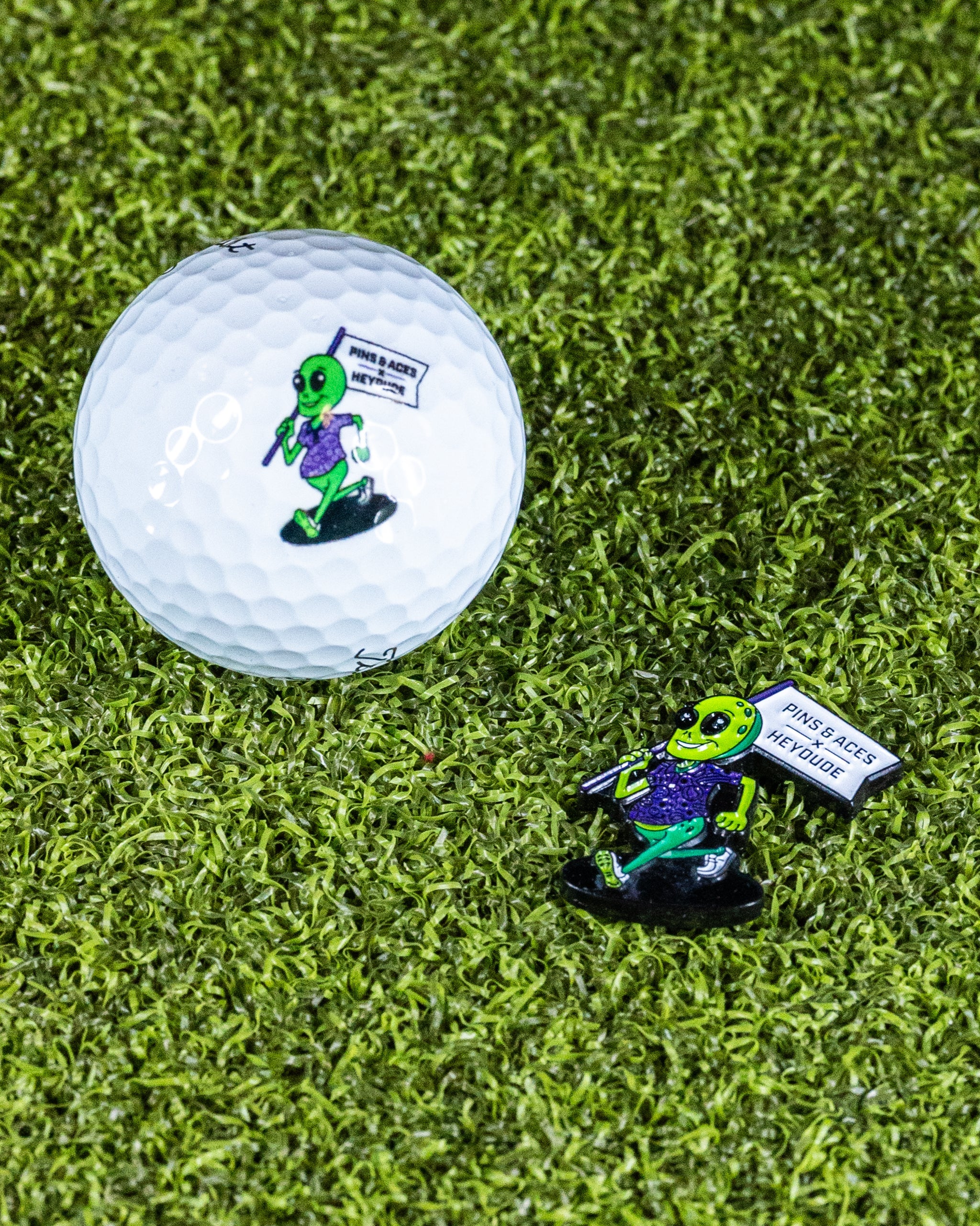 Alien ball marker by HEYDUDE featuring a playful alien design, suitable for golf.
