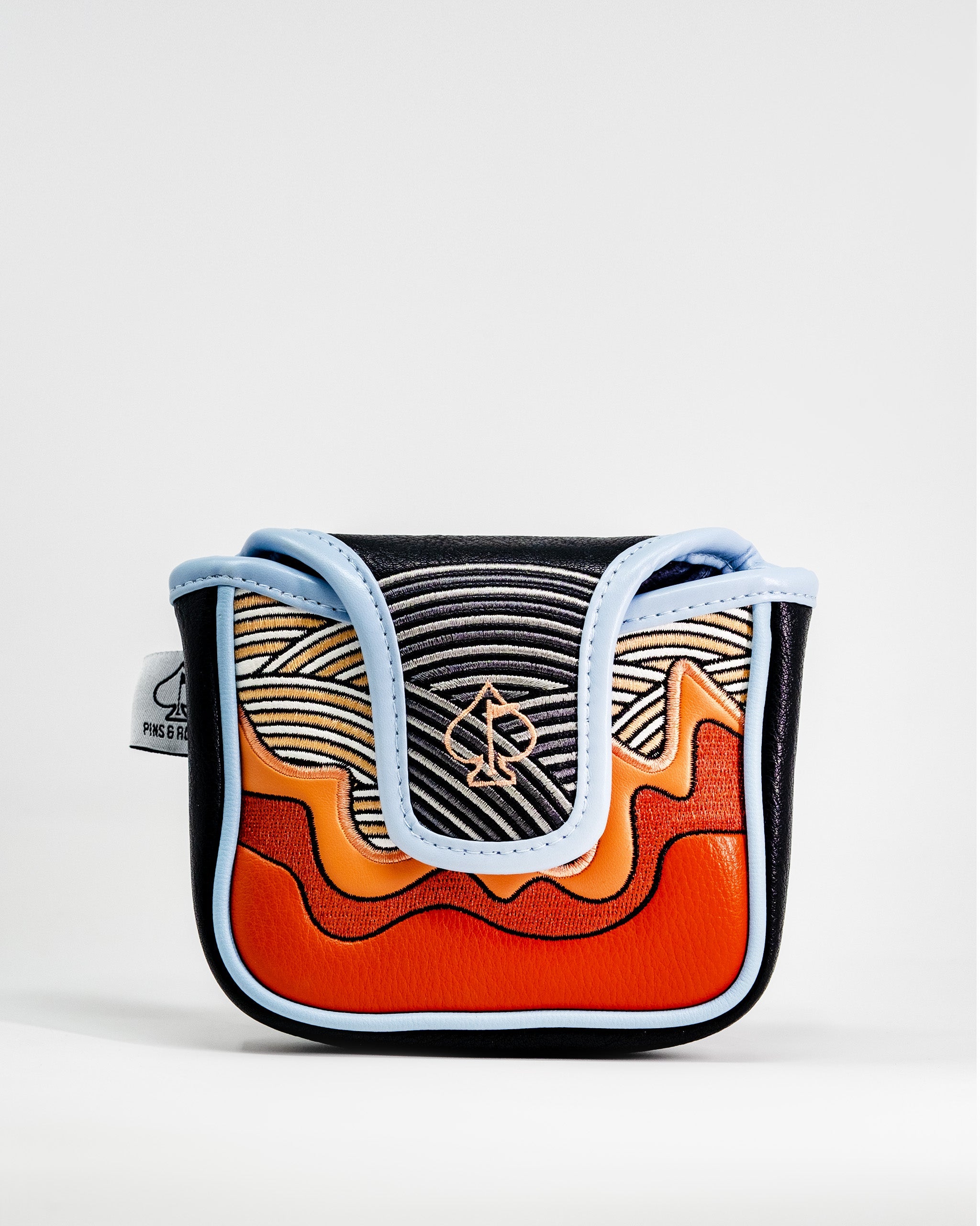Colorful ramen-inspired mallet putter cover with black, orange, and blue accents, featuring embroidered design and a spade logo.