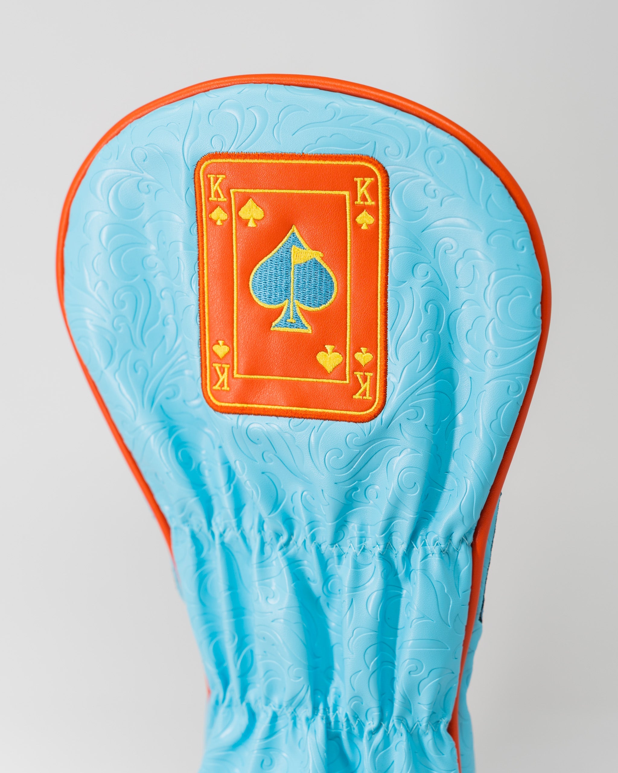 Alt text: Orange Crush King of Spades driver cover featuring a vibrant spade design and neon colors.