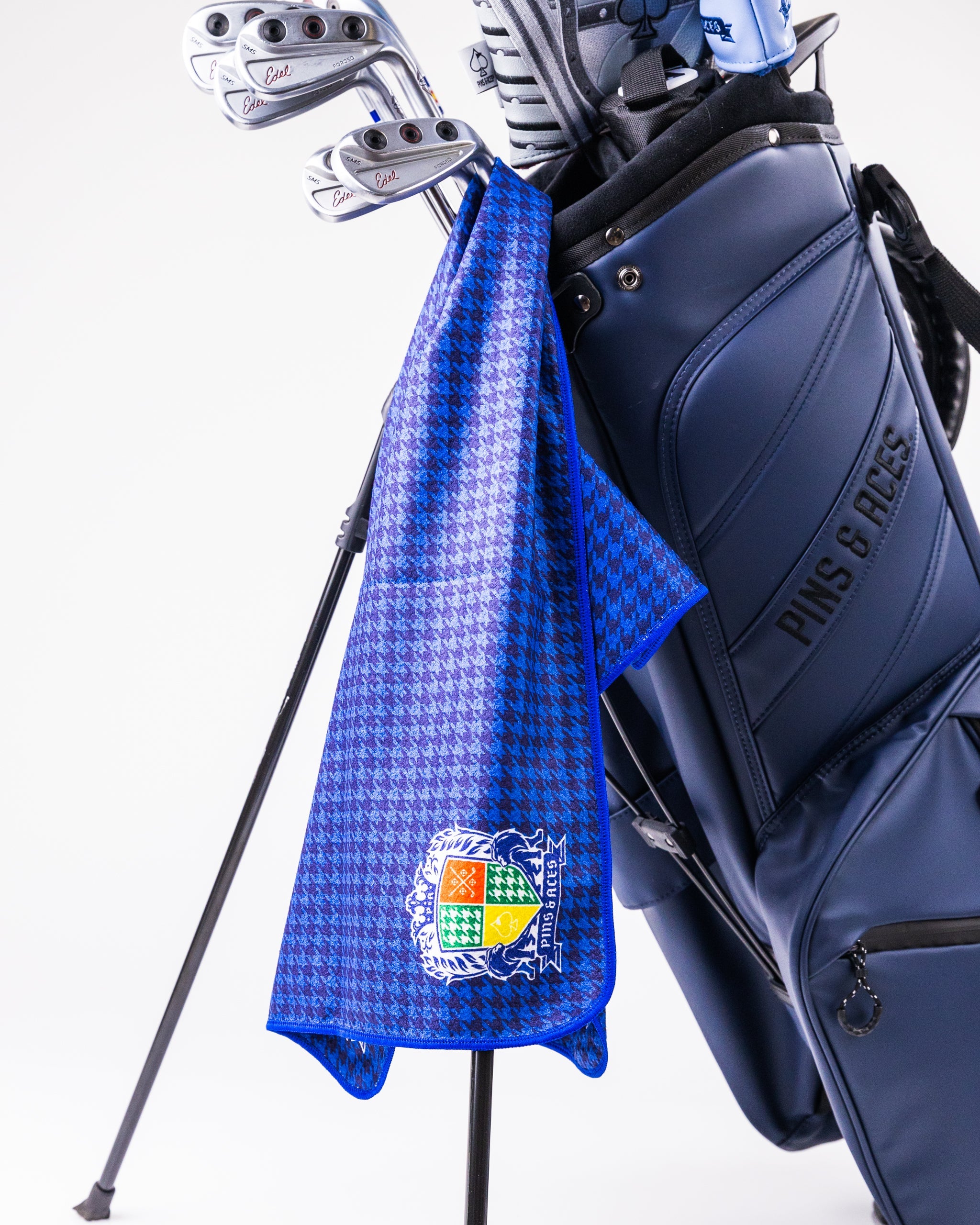 Royal Houndstooth Towel in deep blue and white pattern, showcasing elegant houndstooth design.