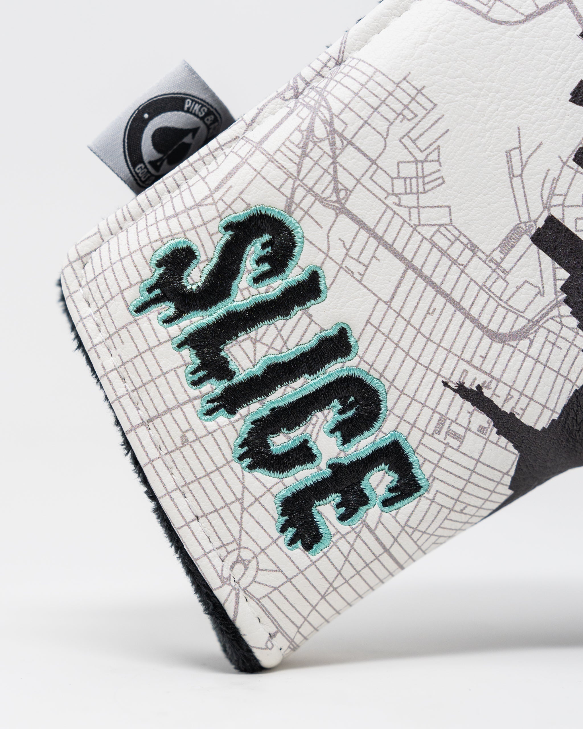 Shady Slice Blade Putter Cover featuring a colorful design and protective fit.