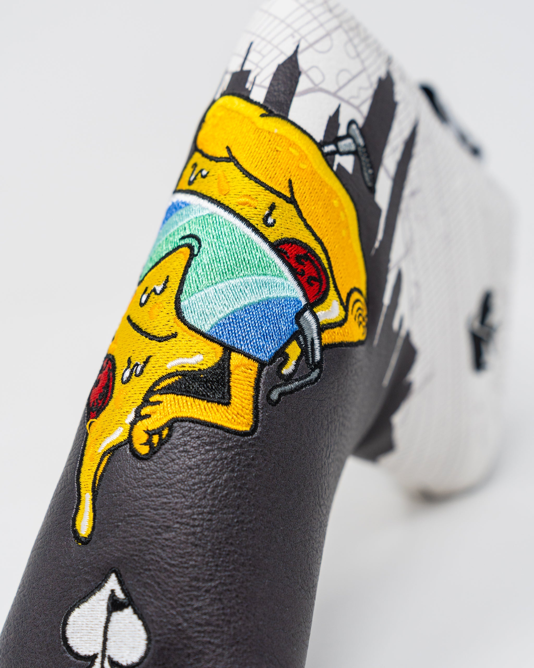 Shady Slice Blade Putter Cover featuring a stylish design with vibrant colors and a secure fit for blade-style putters.