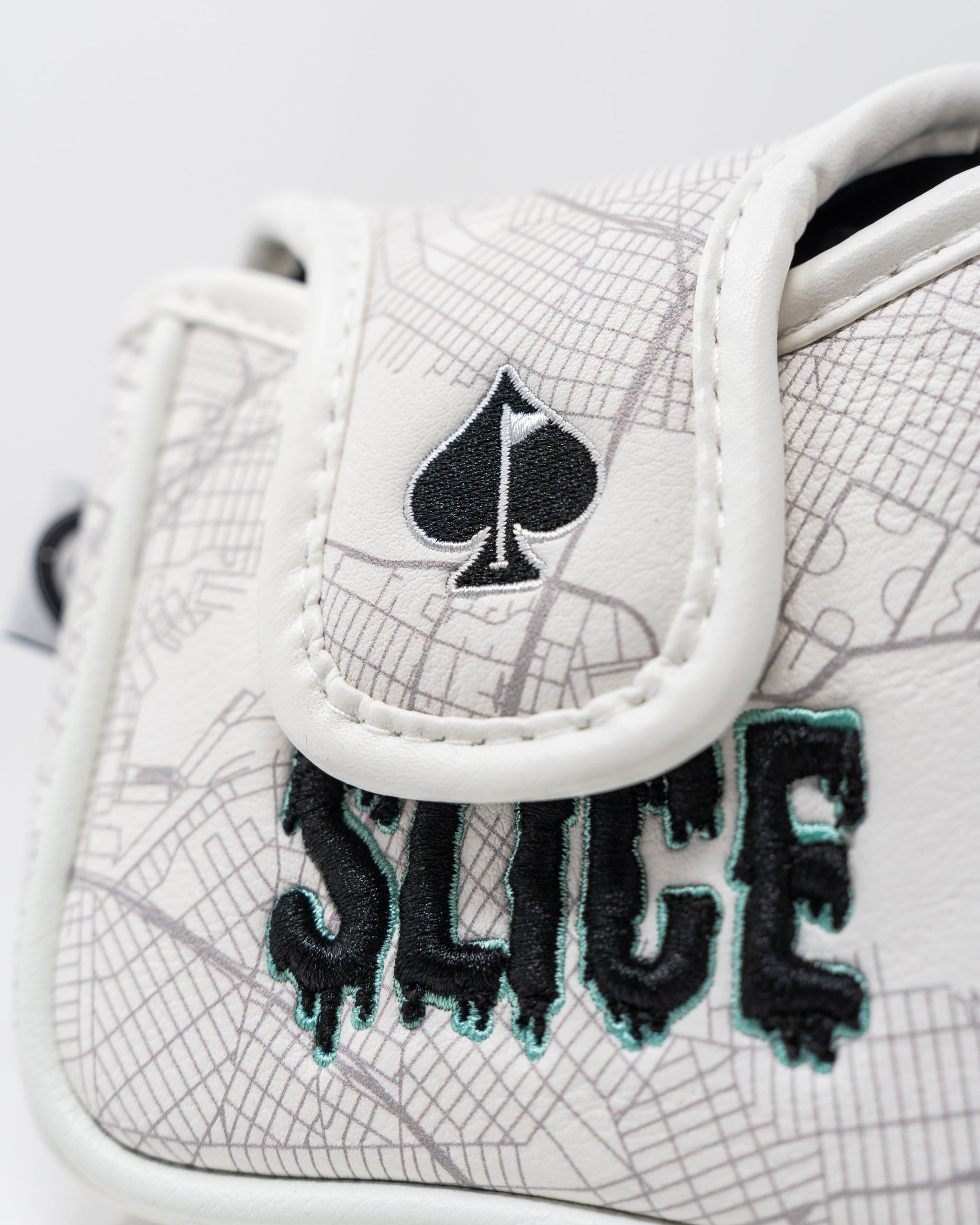 Shady Slice Mallet Cover featuring a colorful, playful design with a golf club graphic, suitable for protecting golf putters.