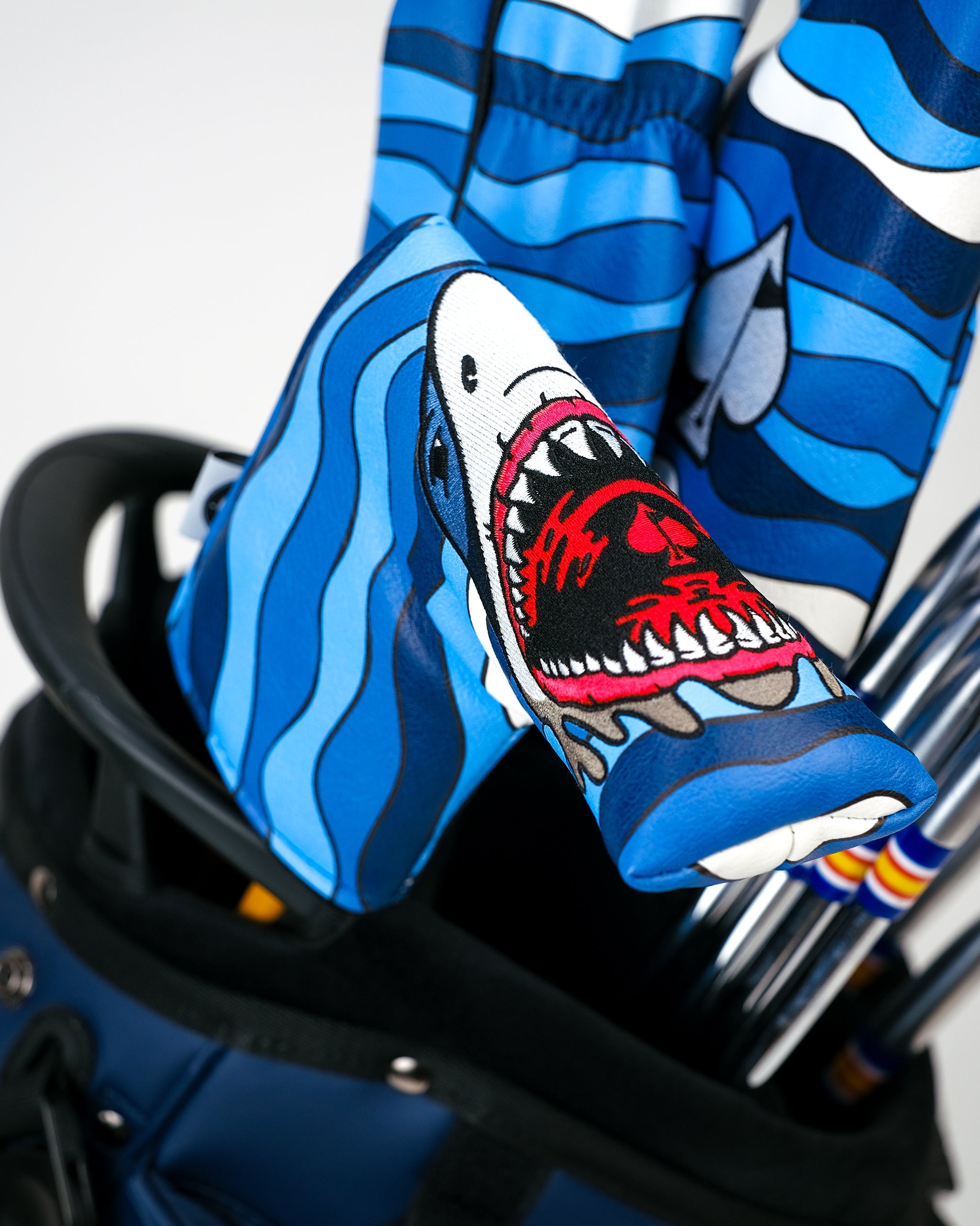 Shark Attack Blade Putter Cover featuring a bold shark graphic, designed to protect putters with style.