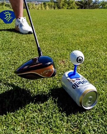 Three white Shottee golf tees arranged on a green grass background, highlighting their innovative design for improved performance.