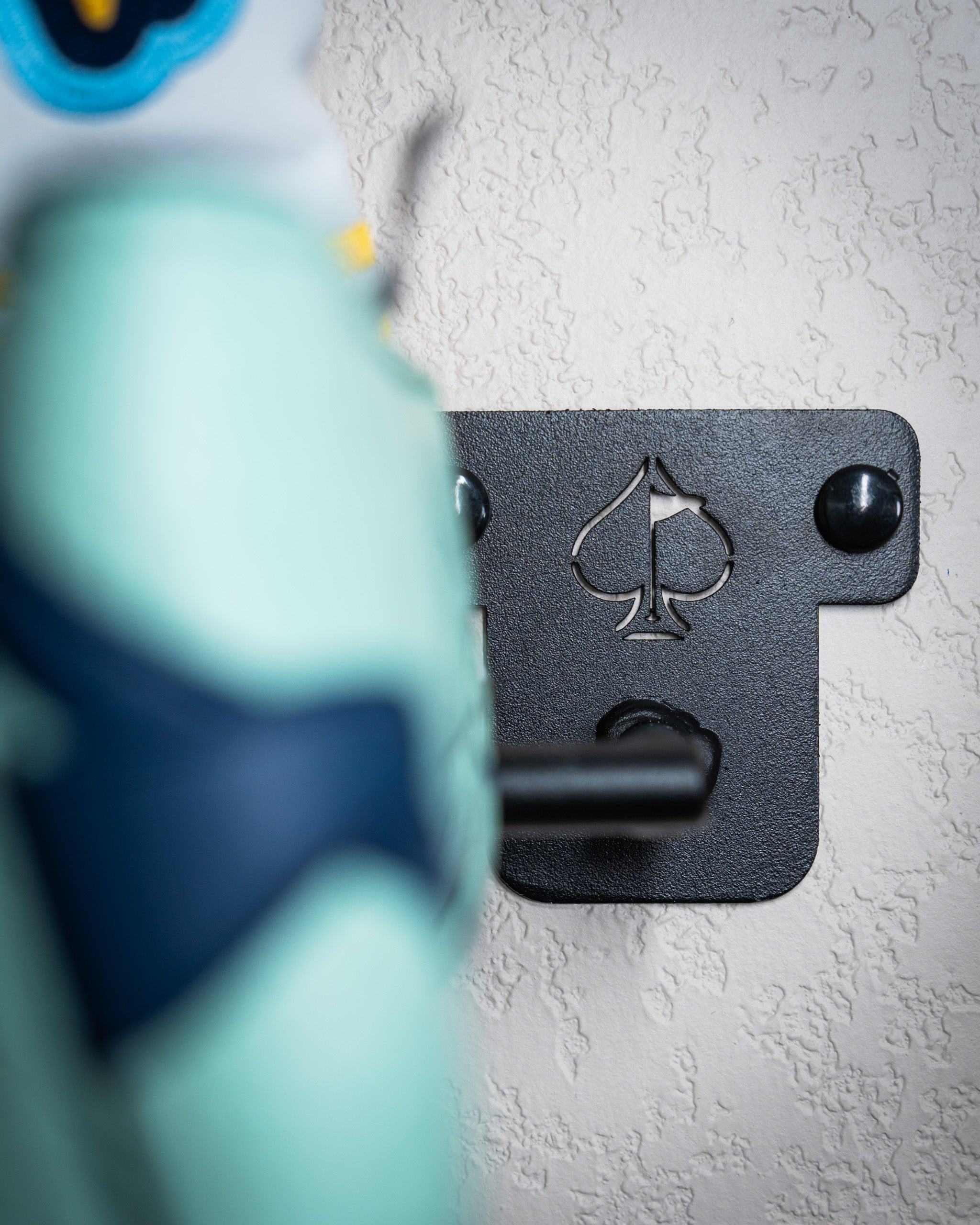 Compact Headcover Rack showcasing a sleek design for organized storage of golf headcovers.