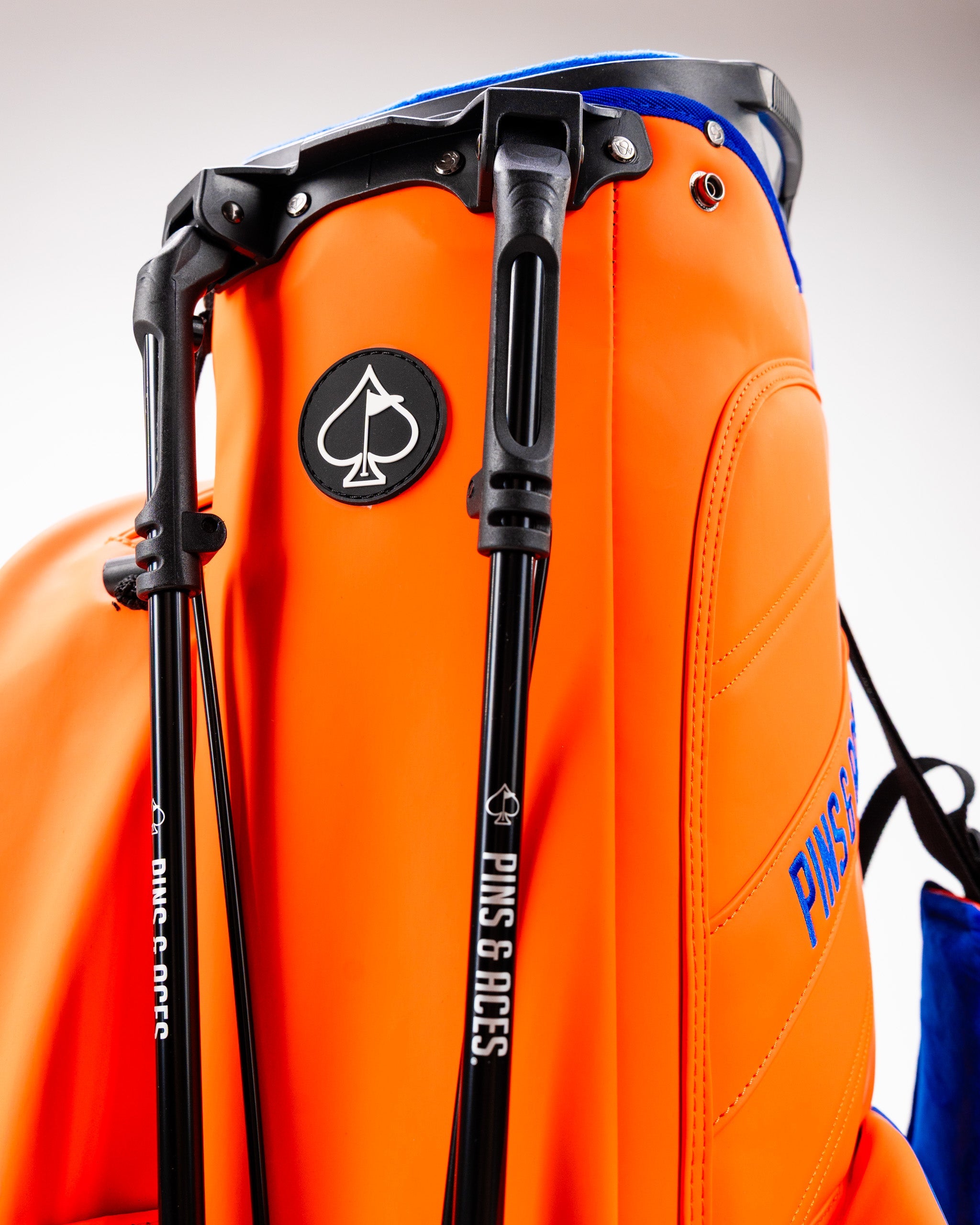 Player Preferred™ Golf Bag in vibrant orange crush color, featuring multiple pockets and a comfortable strap, ideal for golfers.