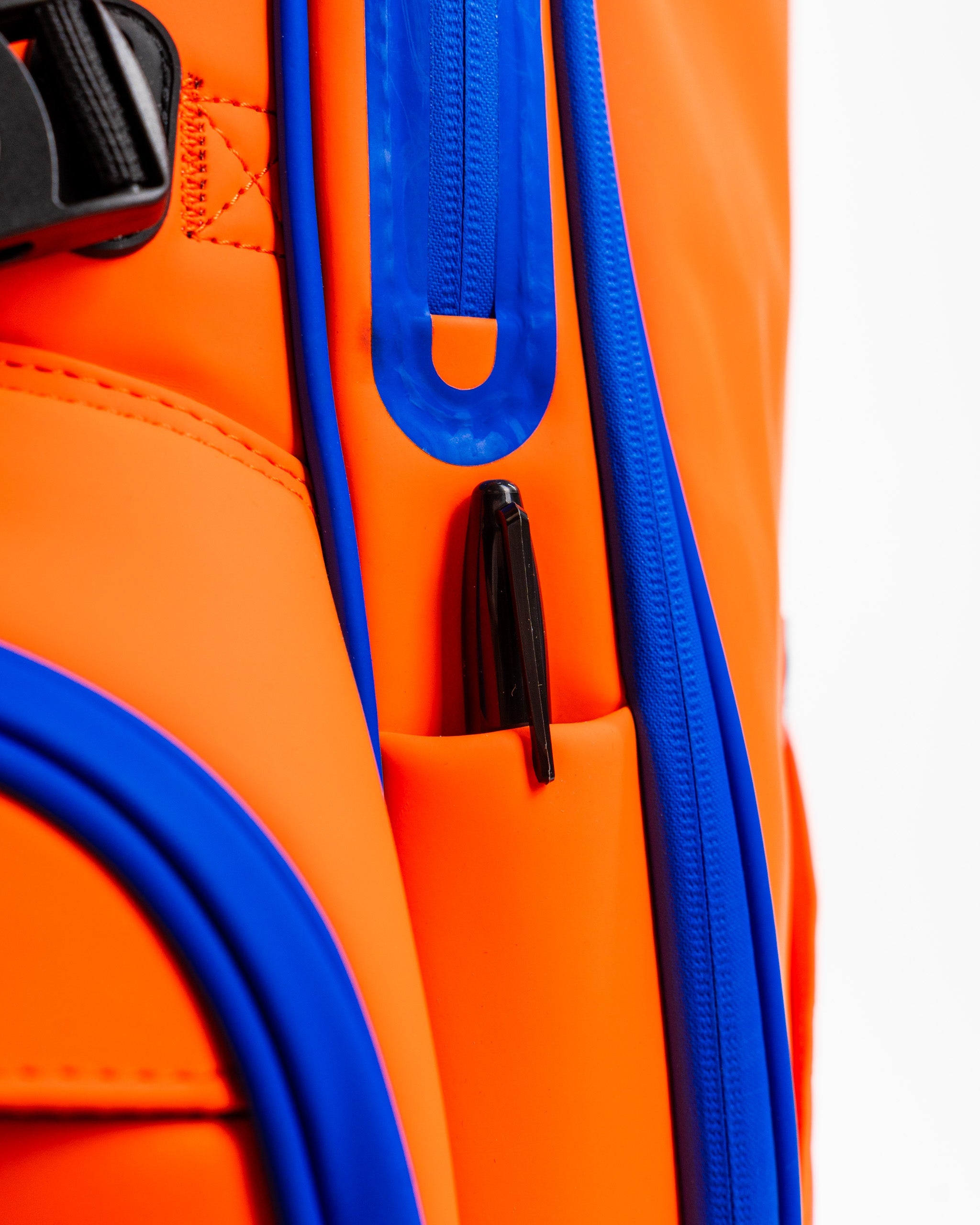 Alt text: Player Preferred™ Golf Bag in orange with a sleek design, featuring multiple pockets and a comfortable shoulder strap.