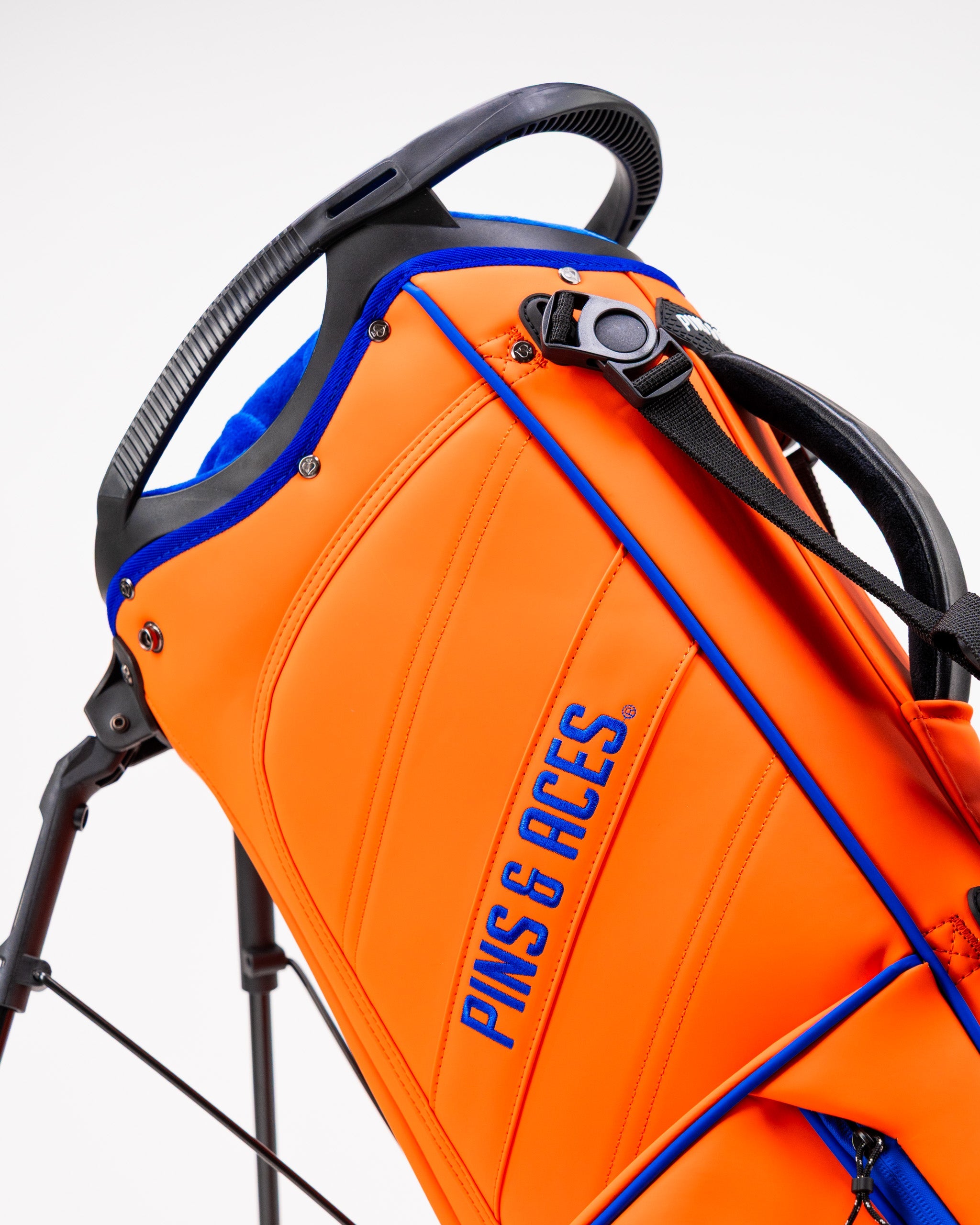 Orange Crush Player Preferred™ Golf Bag featuring a sleek design, multiple compartments, and a comfortable shoulder strap.