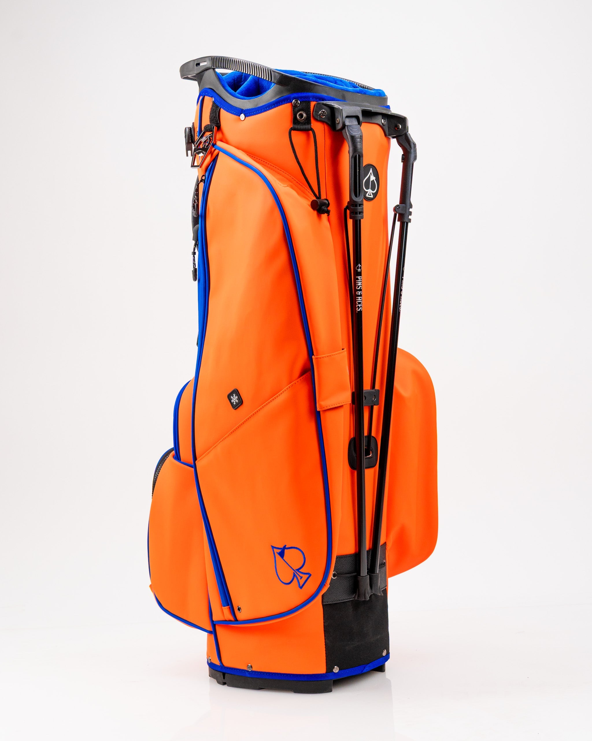 Player Preferred™ Golf Bag in vibrant orange with multiple pockets and padded straps, ideal for golfers.