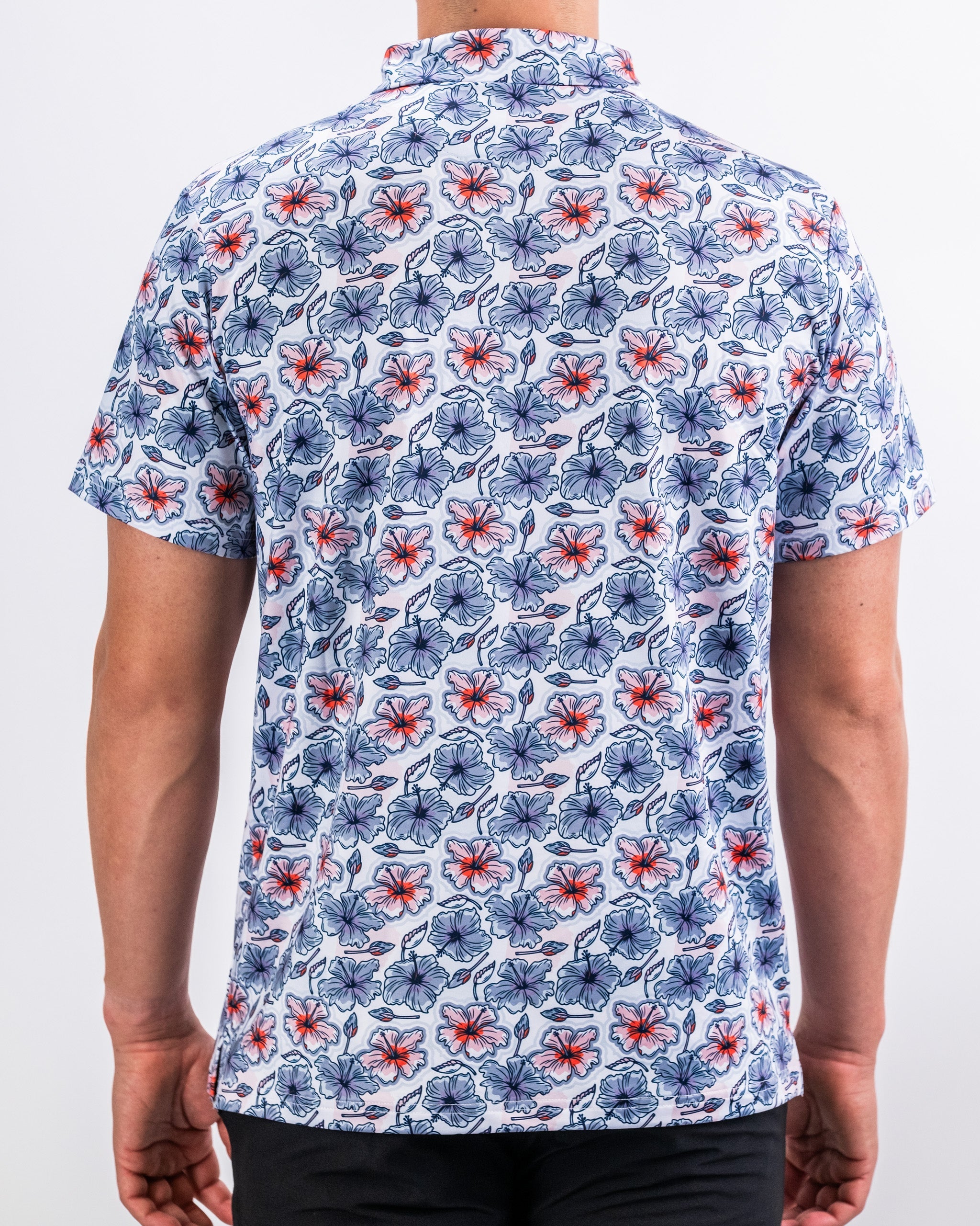 Hibiscus Harmony men's shirt featuring vibrant hibiscus floral print on a light background.