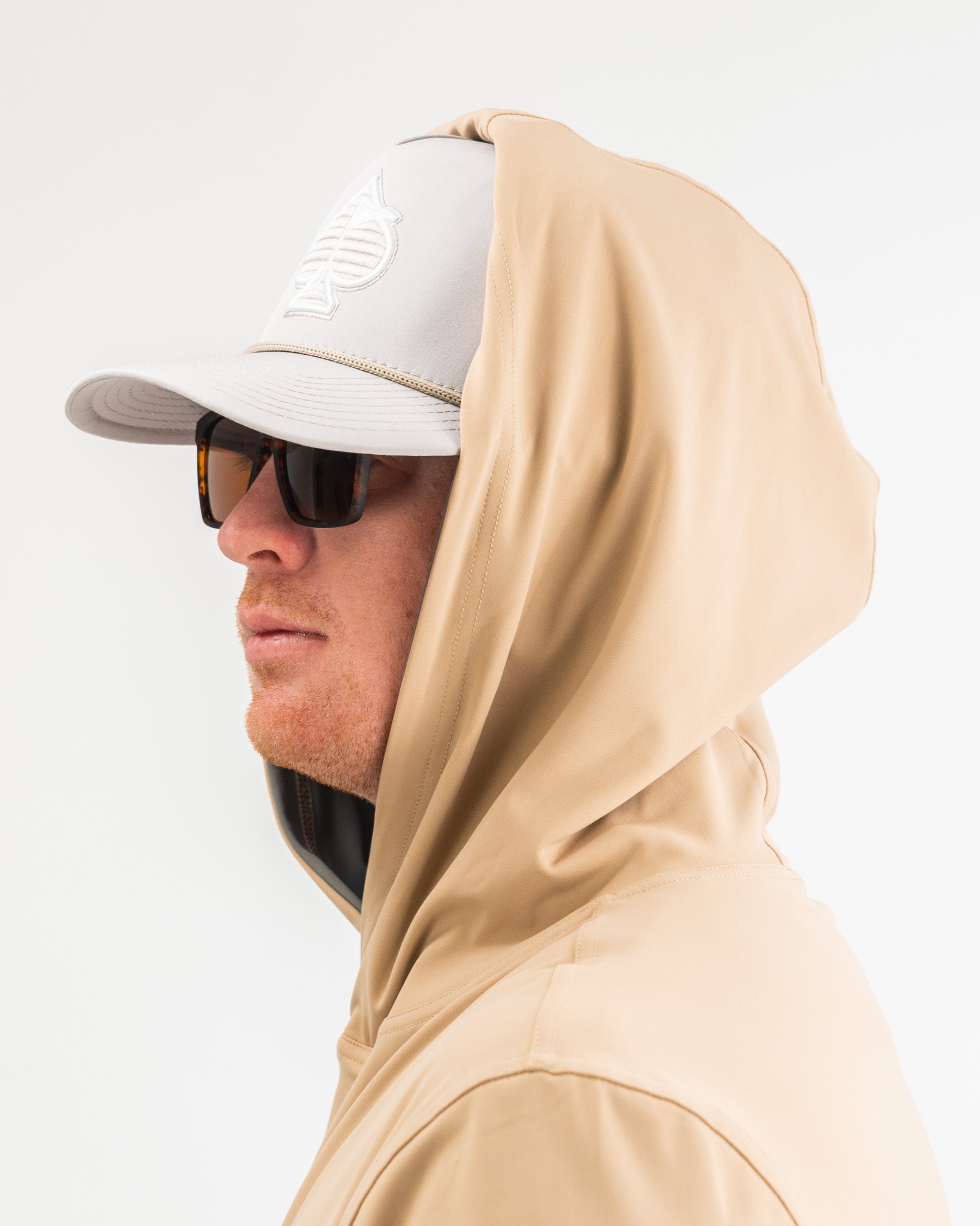 Performance Golf Hoodie in Big Blind Sand, featuring a stylish design and lightweight fabric, ideal for golfers.