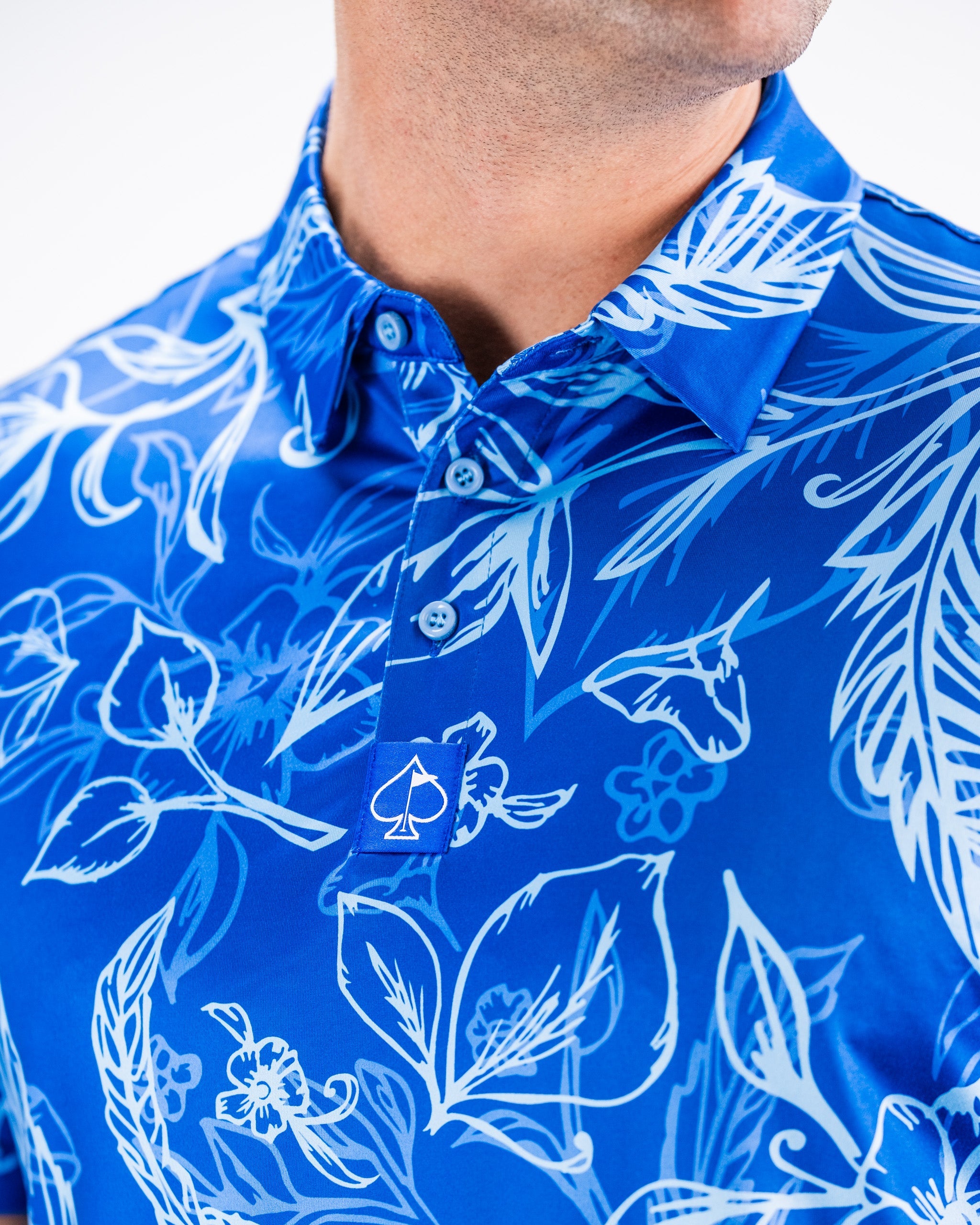 Men's Cabo Ocean short-sleeve shirt featuring a vibrant tropical design with shades of blue and green.