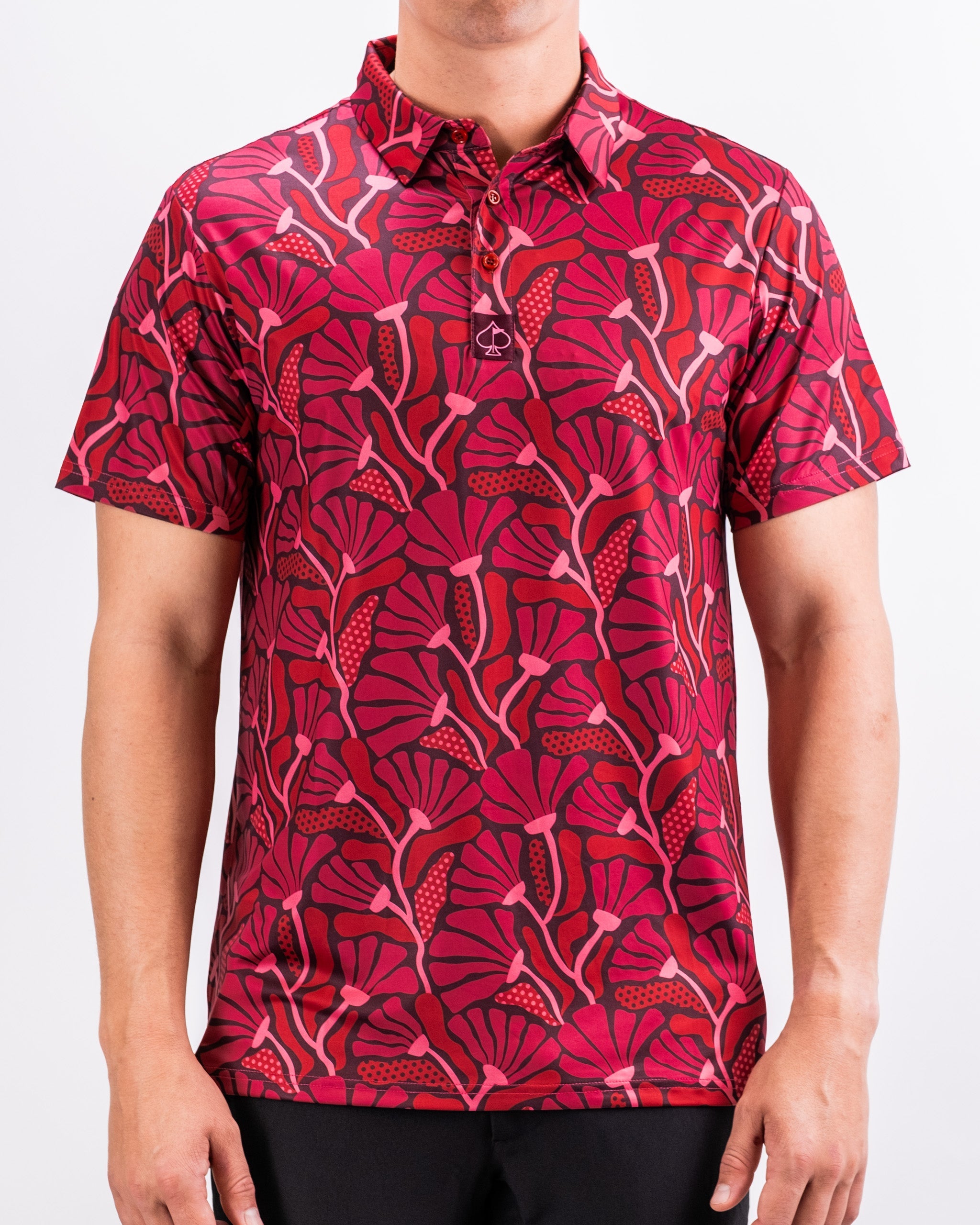 Alt text: "Garden Party Crimson Bloom men's shirt featuring a vibrant floral pattern against a light background."