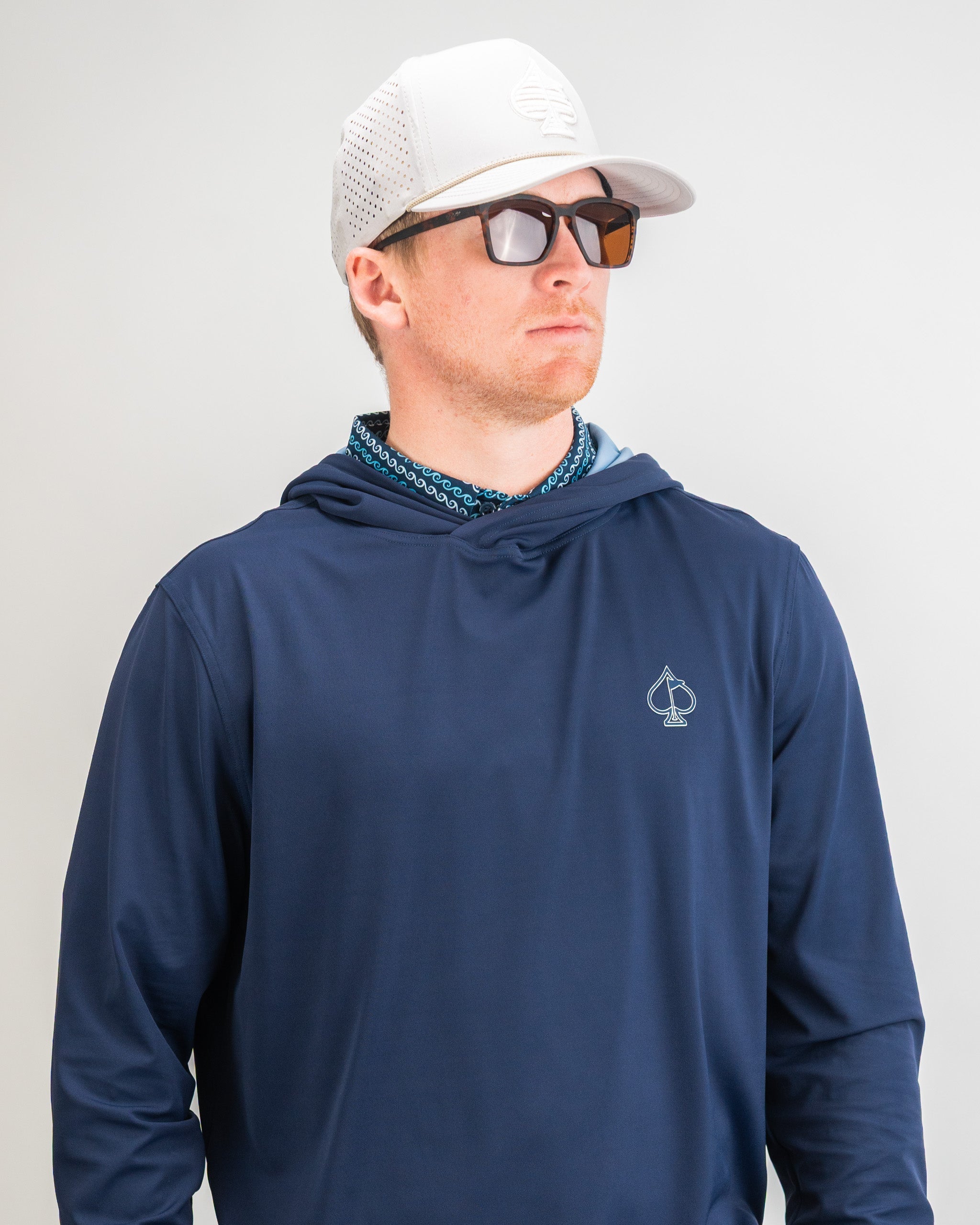 Performance Golf Hoodie in Navy, featuring a stylish design suitable for outdoor activities.