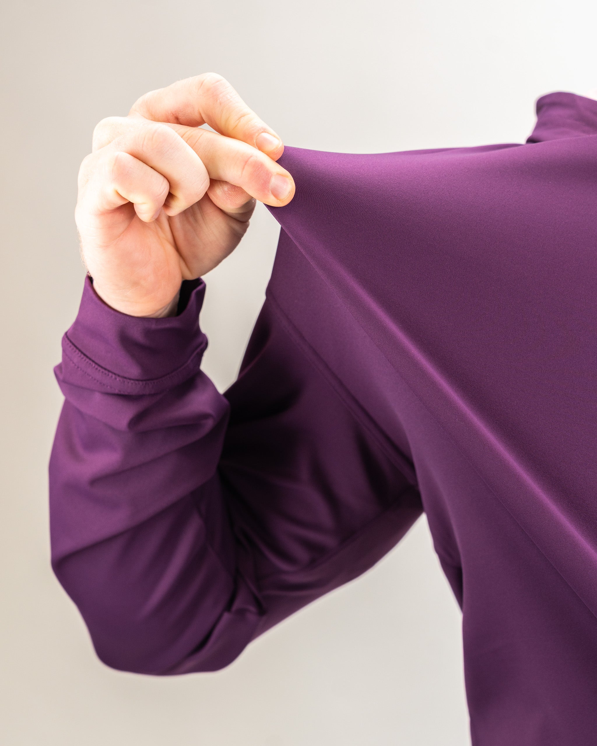 Performance Golf Hoodie in Houndstooth Raspberry design, featuring a stylish patterned fabric and a comfortable fit for active wear.