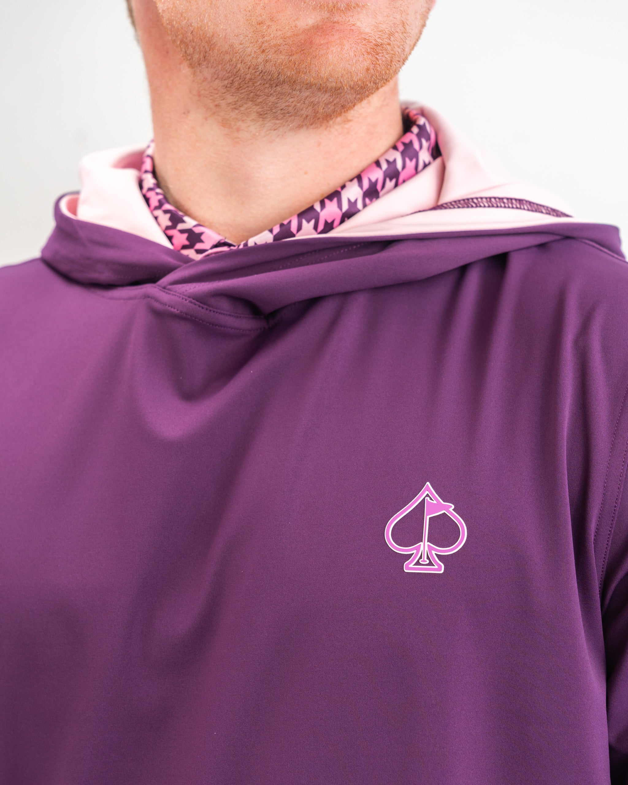 Performance Golf Hoodie in houndstooth raspberry pattern, featuring a modern design and comfortable fit, ideal for golfing and casual wear.