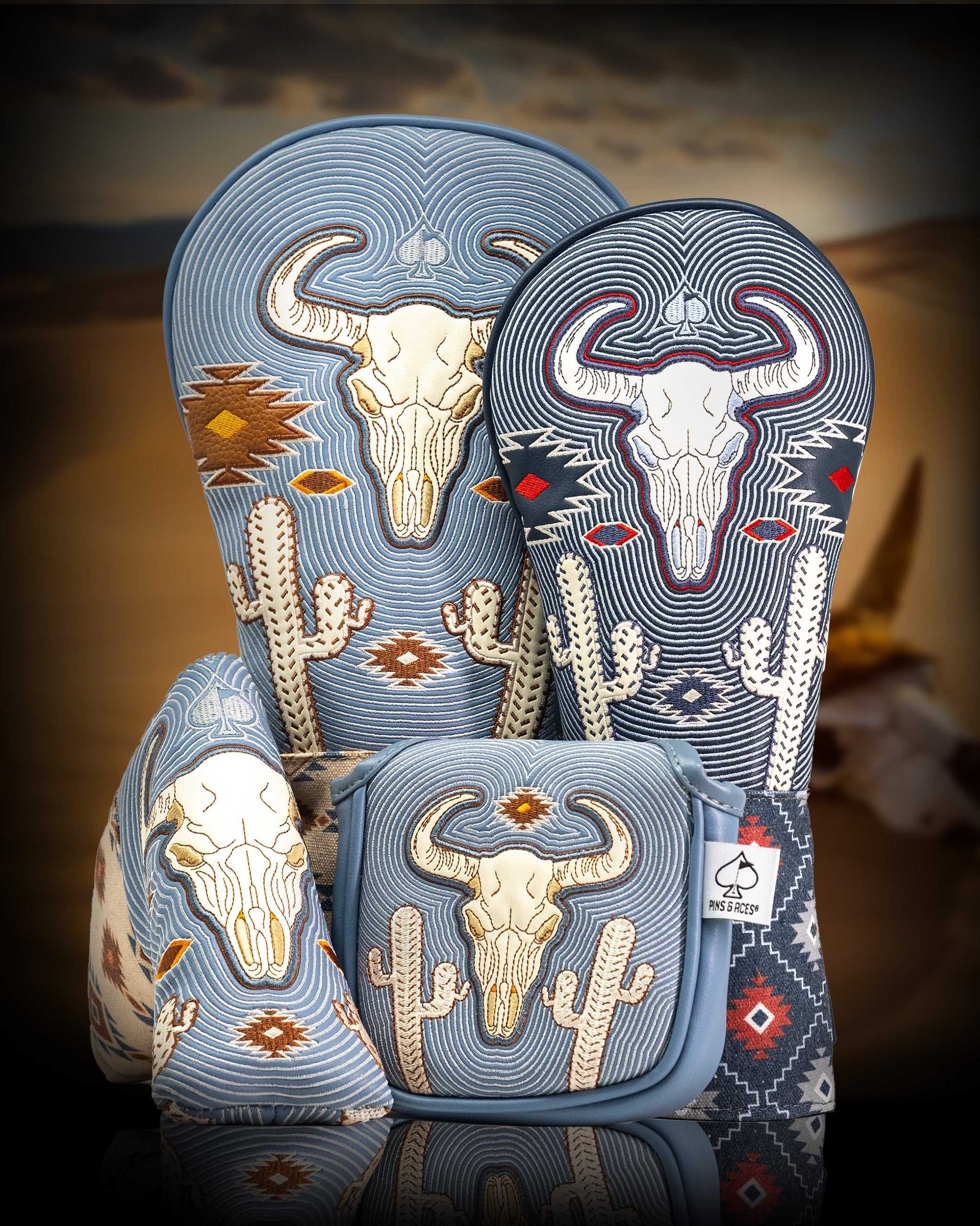 Set of Western Aesthetic Mallet Putter Covers featuring embroidered bull skulls, cacti, and desert motifs in blue, beige, and red.